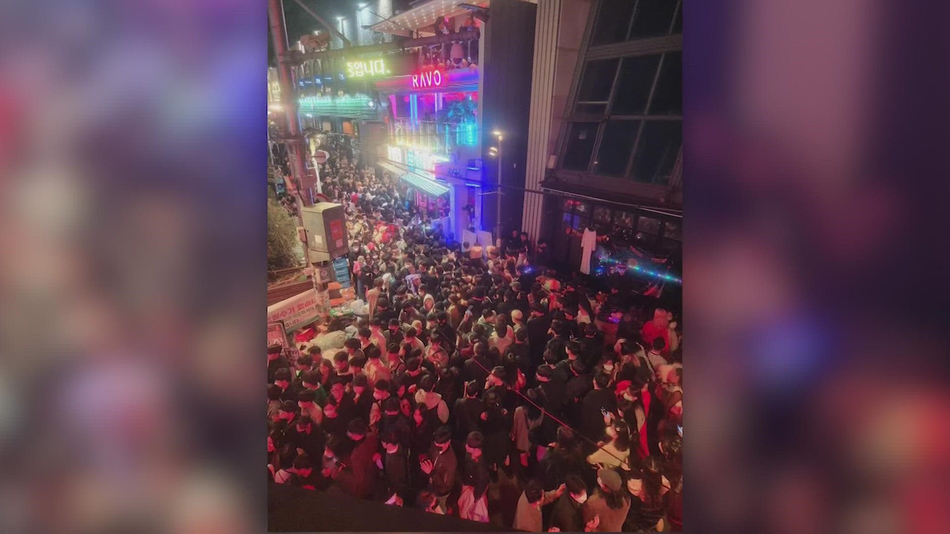 Police said the victims were crushed by a large crowd pushing through a narrow street during Halloween festivities.