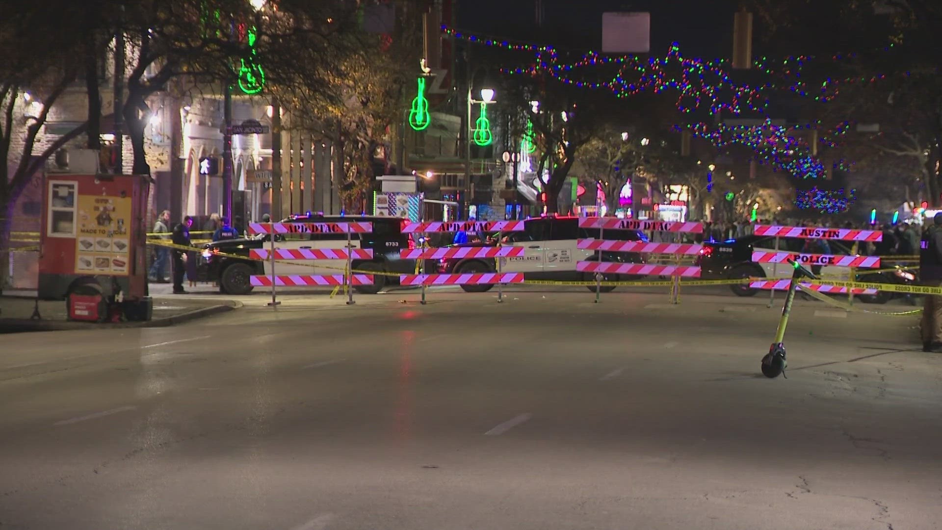 Austin police say three officers shot and killed a man who pointed a gun at officers along East 6th Street Saturday night.