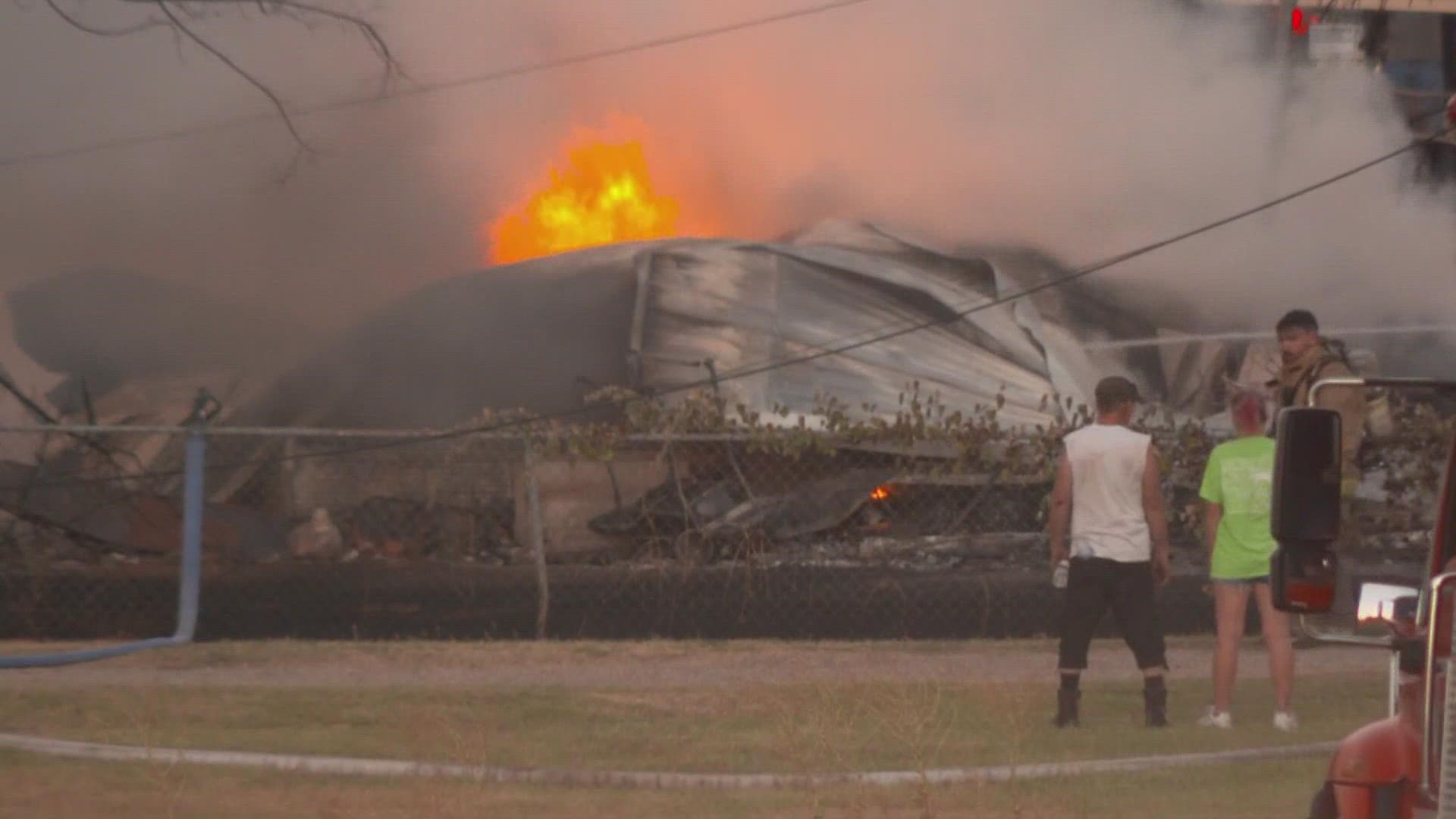 The fire destroyed three homes and five structures before it was contained.