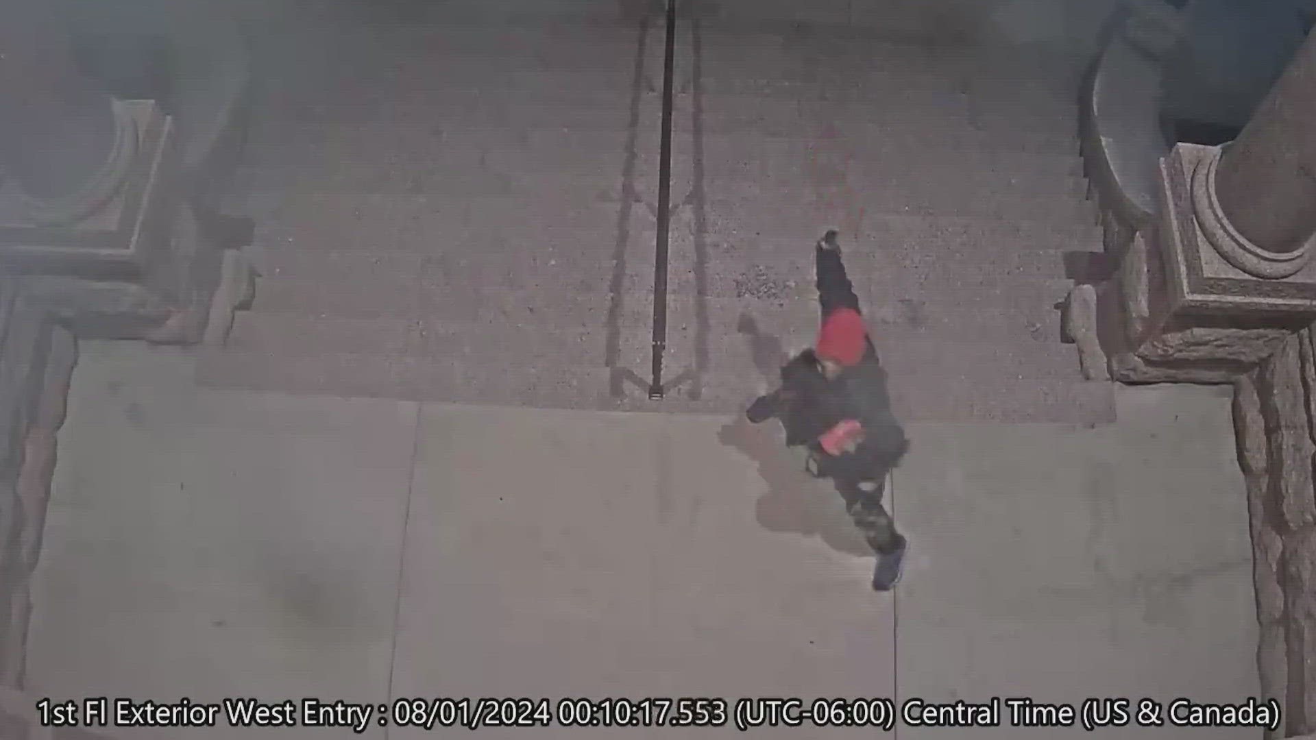 Security footage released by police shows a man throwing a rock at the west side exterior doors of the 1895 courthouse in Fort Worth shortly after midnight Monday.