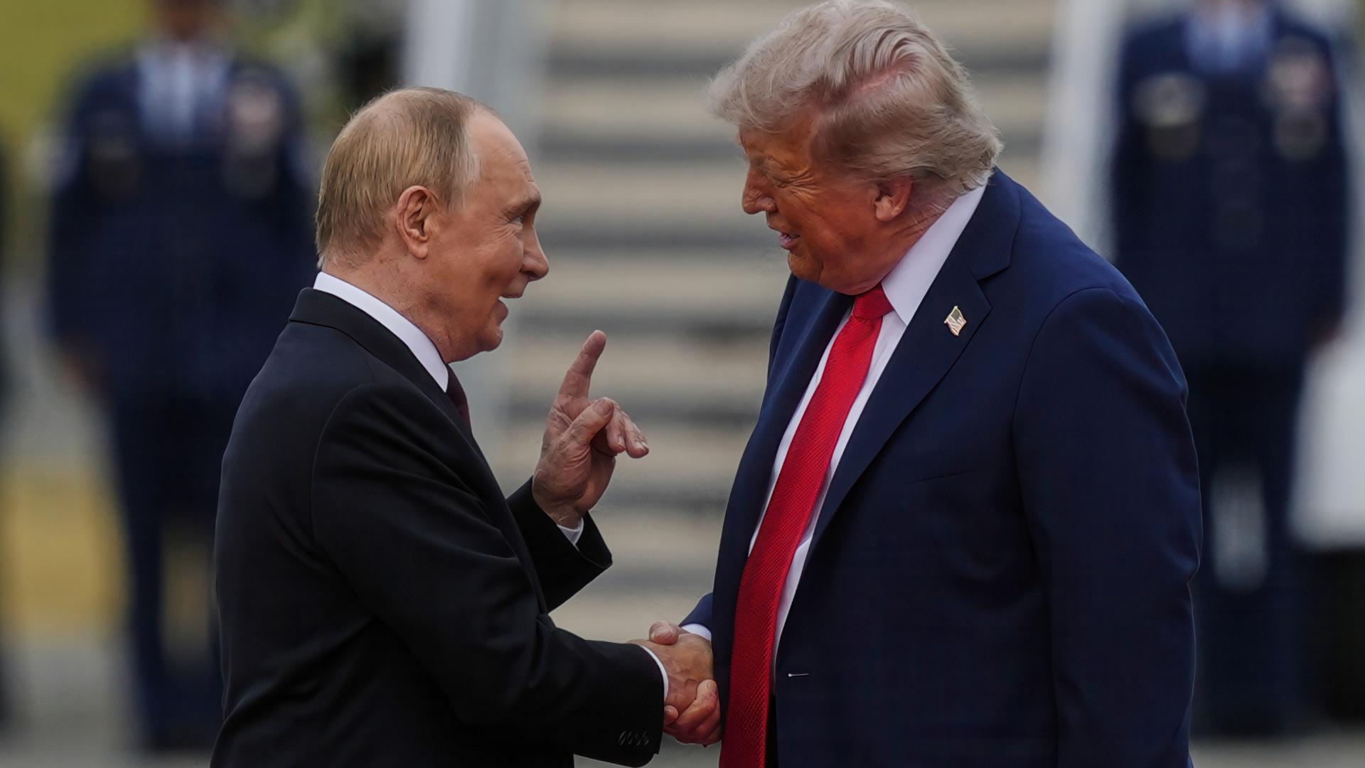 President Donald Trump and President Vladimir Putin shake hands after arriving in Anchorage on August 15, 2025.
