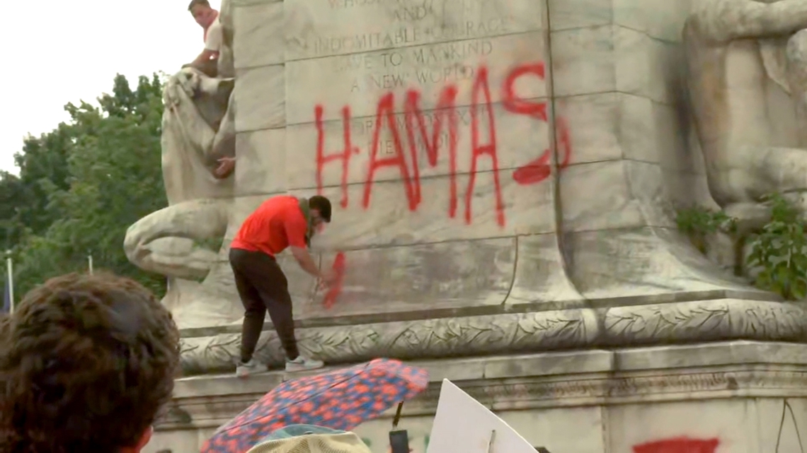 Protester sprays 'Hamas is comin' on Christopher Columbus statue in ...