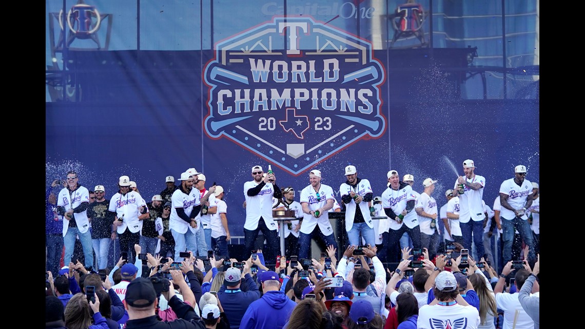 Rangers fans even accept Cardinals fan at World Series parade