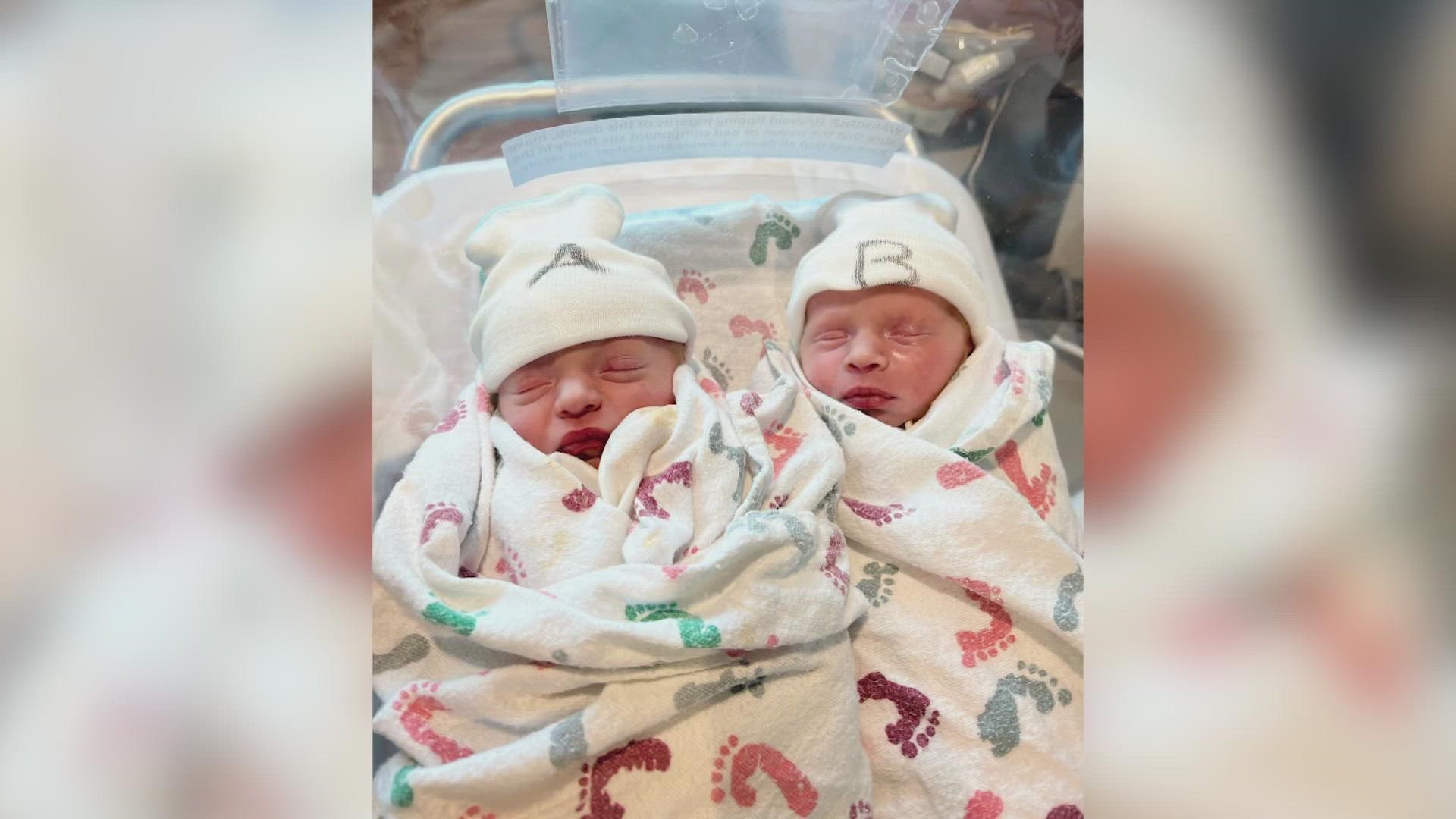One was born at 11:55 p.m. on Dec. 31, then the other came to the world at 12:01 a.m. Jan. 1.