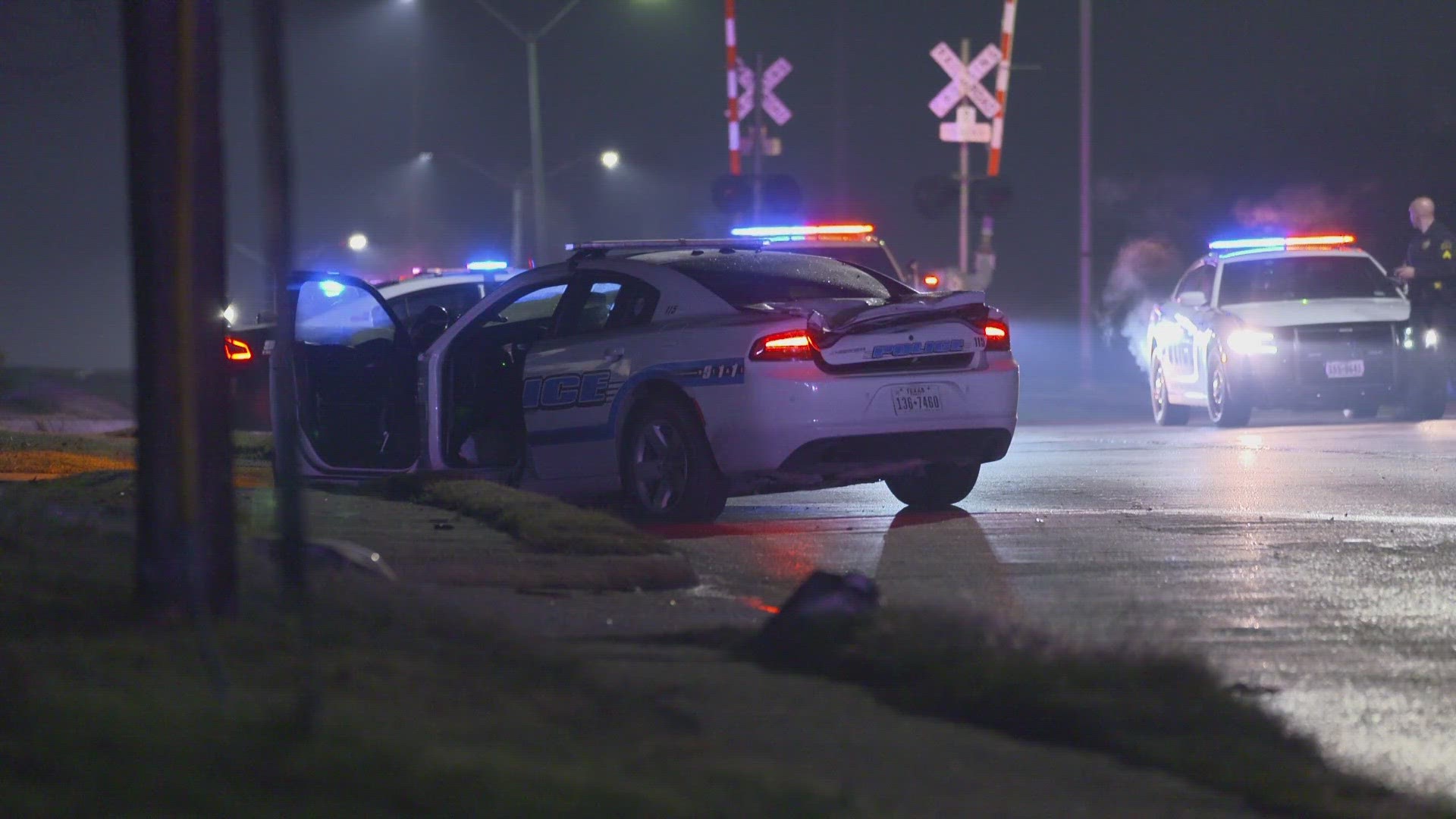 The squad car was pursuing a fleeing vehicle when it crashed into another in an intersection in Dallas, police said.