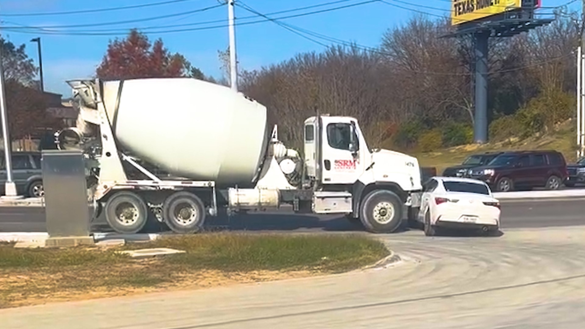 A North Texas driver recorded a video Wednesday of a cement truck ramming into another vehicle without stopping.