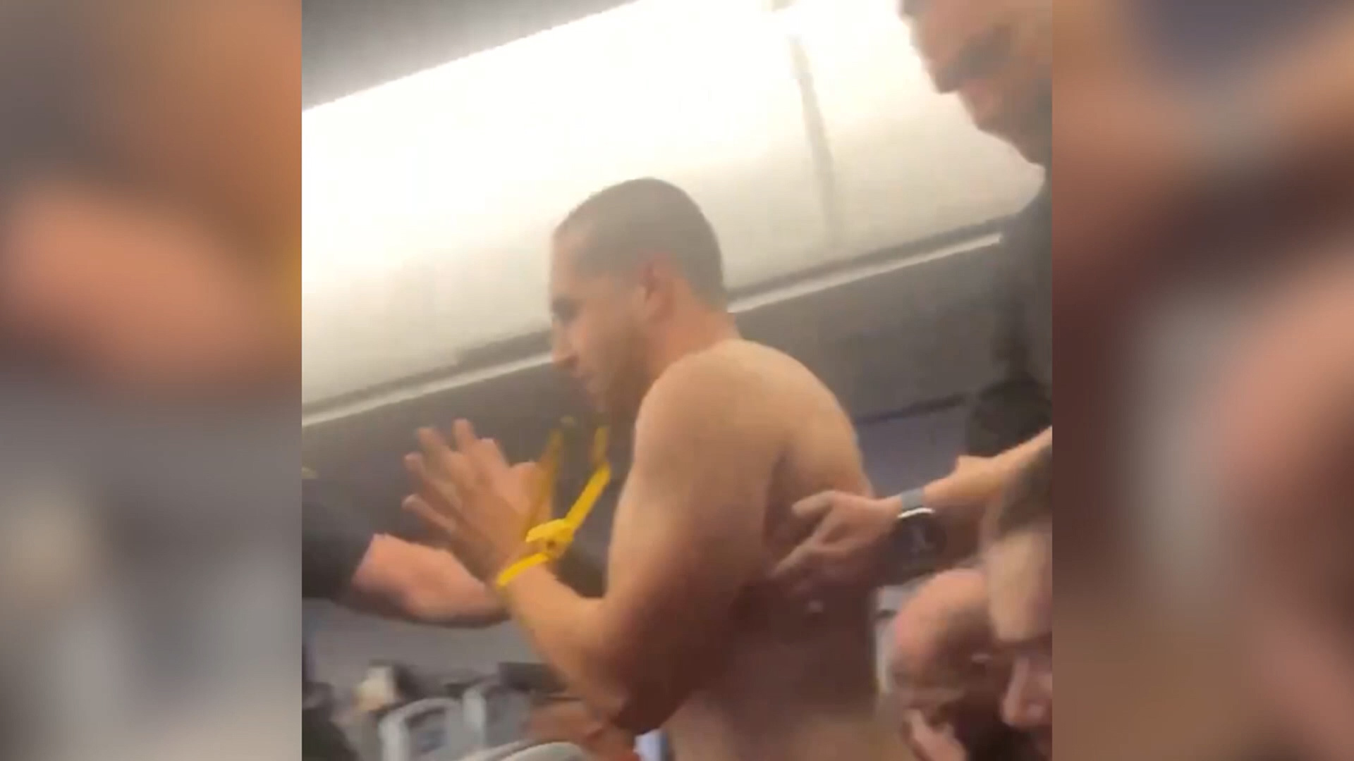 A federal grand jury indicted a New Jersey man Wednesday in an incident where passengers jumped in to help flight attendants restrain the man.