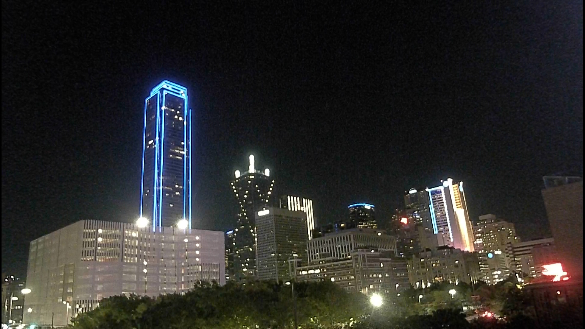 The Downtown Dallas skyline beamed blue Friday night in honor of Dallas Police Officer Darron Burks, who was shot and killed in the line of duty.