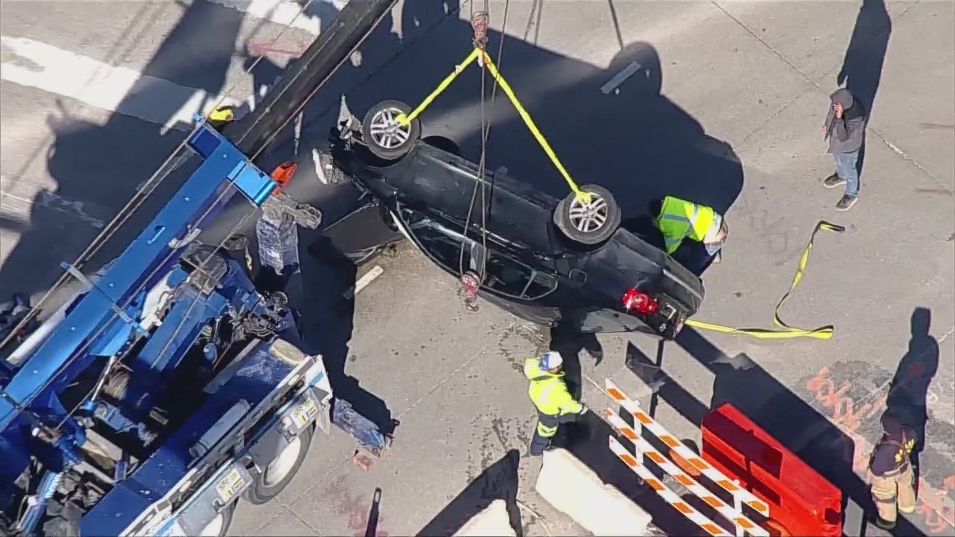 Dallas TX Construction workers injured after car falls into underground hole officials say