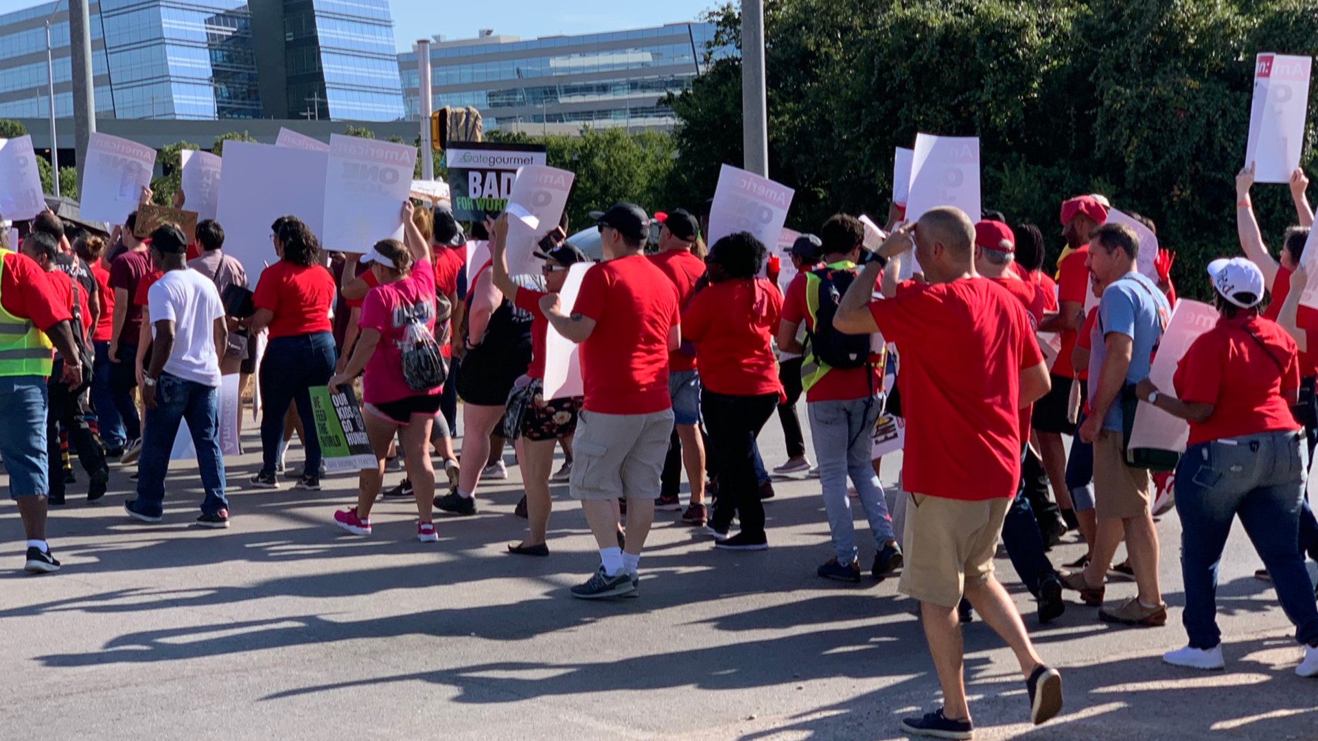 Employees of catering services that supply food on American Airlines flights are protesting Tuesday outside the airlines' headquarters in Fort Worth.
