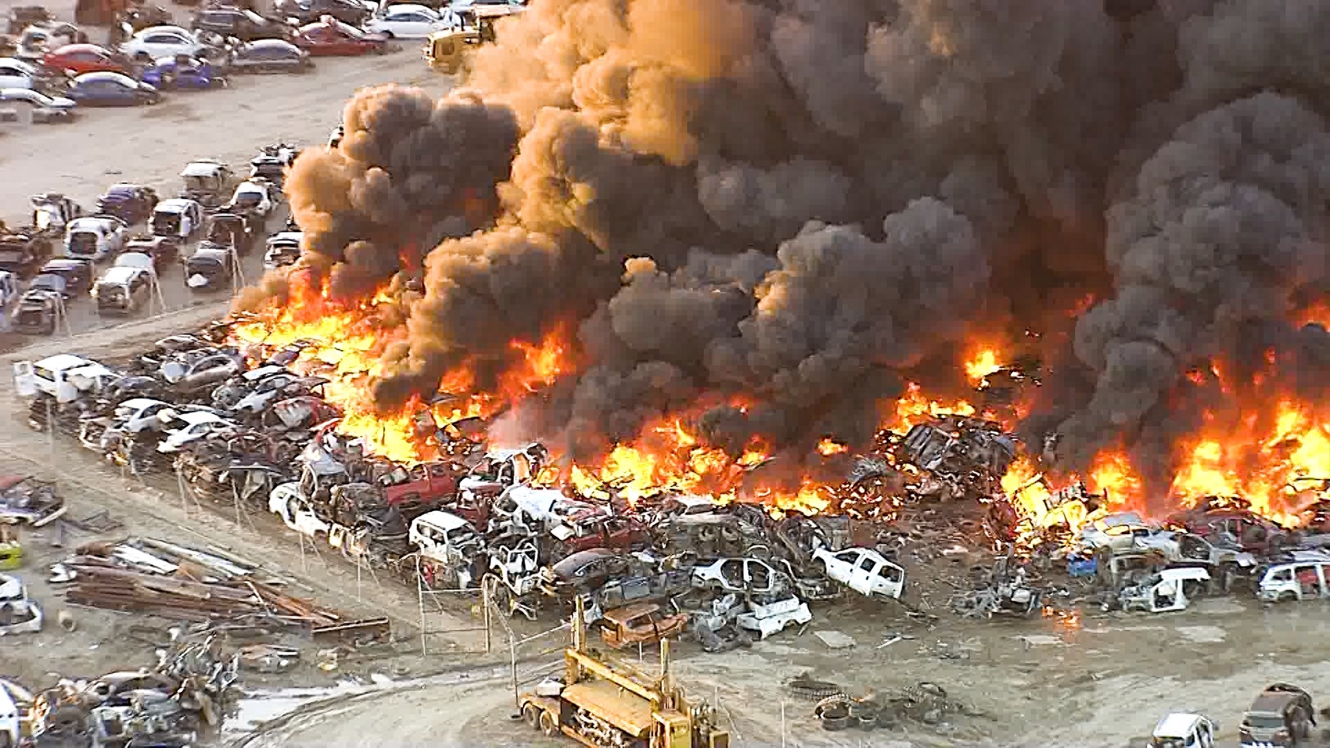 A massive fire was happening at a Grand Prairie salvage yard on Friday, March 1, 2024.