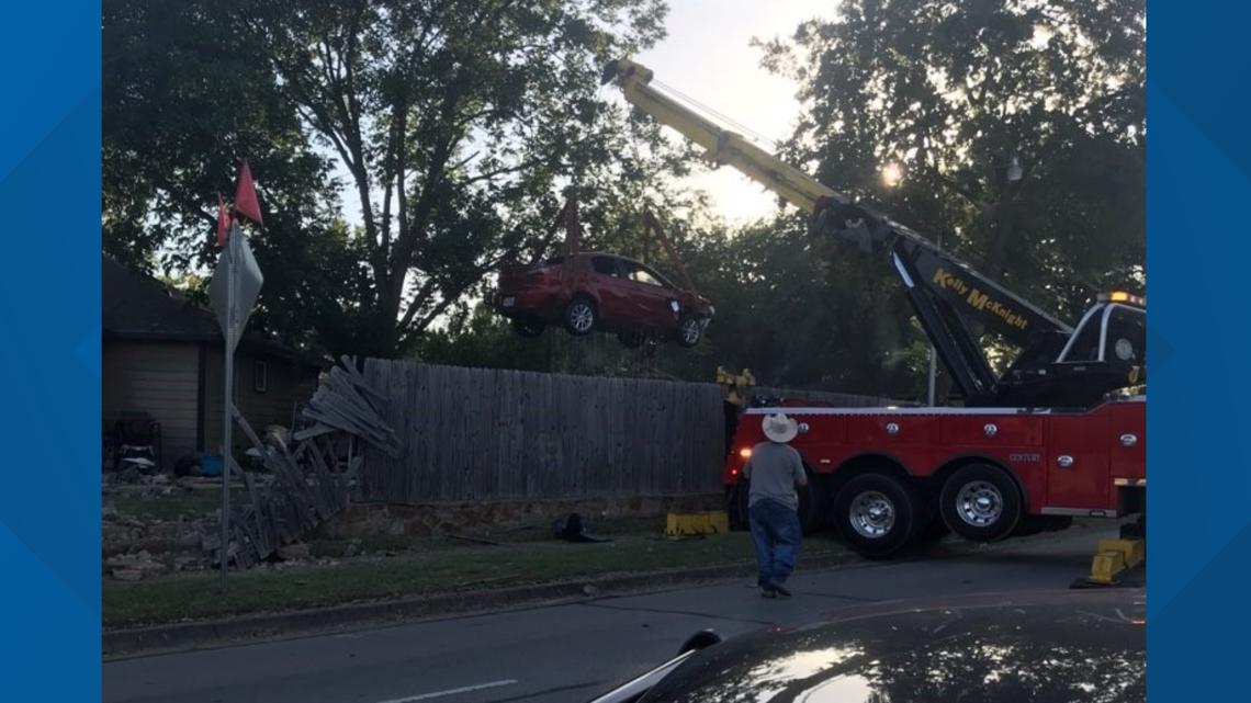PHOTOS: Car crashes through fence, into pool at Arlington home | wfaa.com