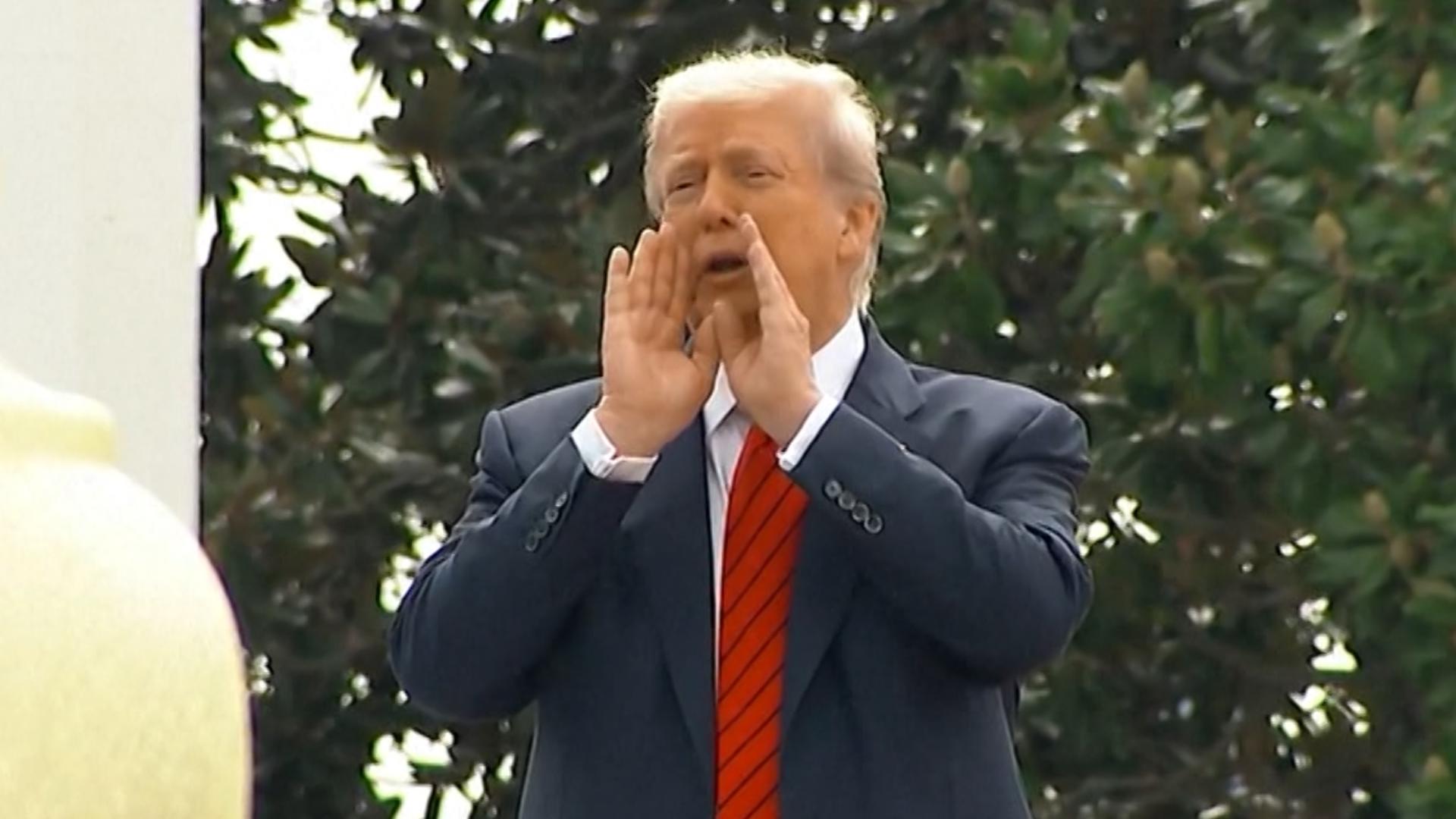 President Donald Trump shouted down at reporters from the roof of the White House, seemingly planning a new addition to the historic building.