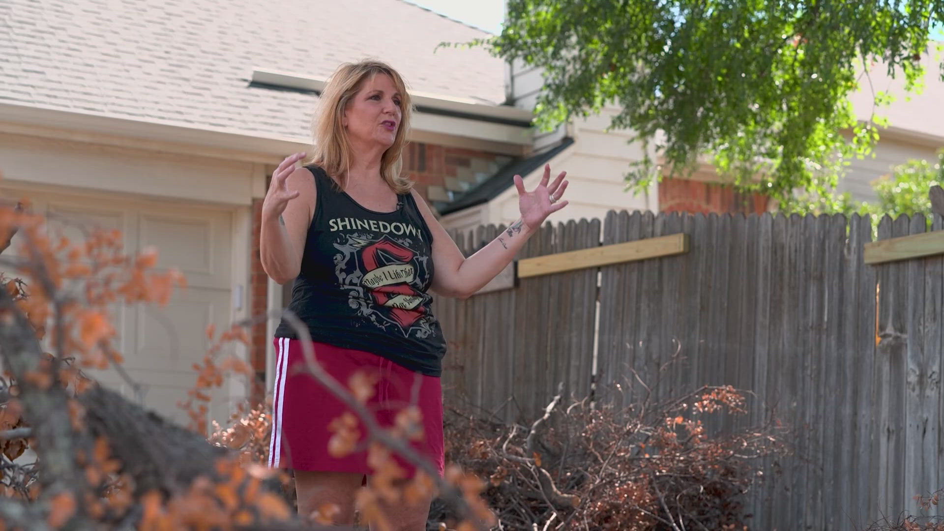 Volunteers and good neighbors help a Plano family clean up their storm debris.