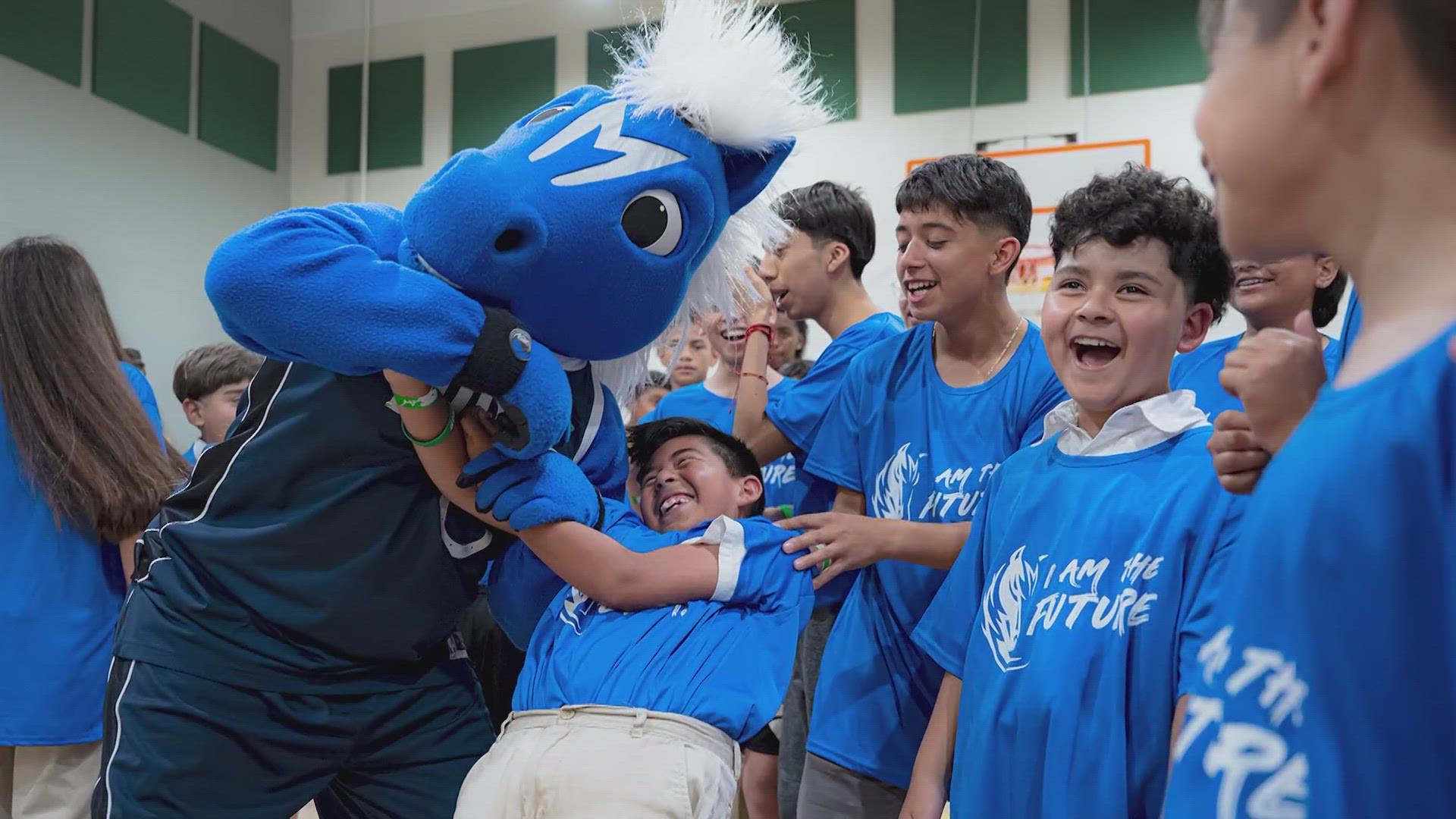 Students at the School for the Talented and Gifted (TAG) in Pleasant Grove got to meet the D-Town crew and Mavs mascot, Champ. They were also gifted shoes!