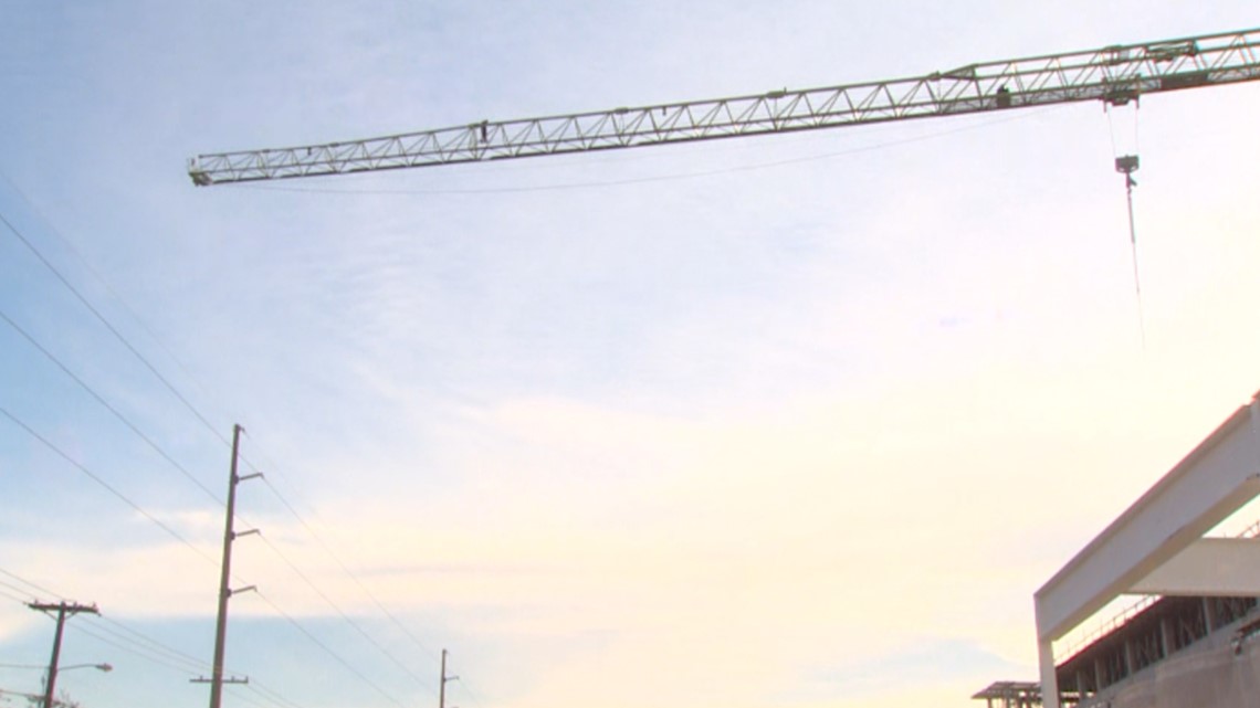 Police shut down Dallas street as crews respond to man on crane