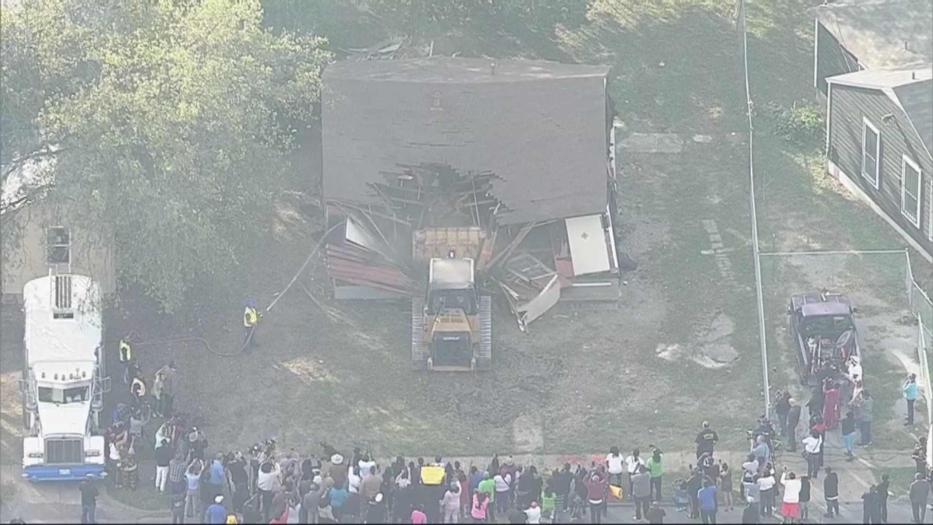 Crews demolished the home where 13-year-old Shavon Randle was found dead in August after being taken for drug ransom.