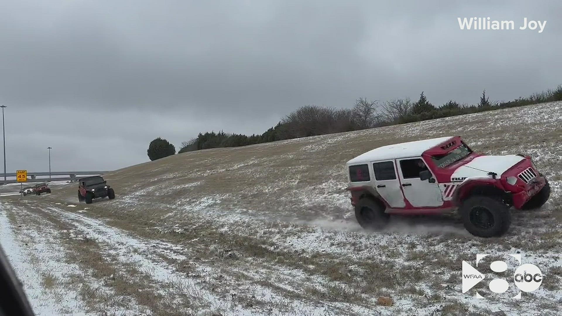 Drivers who were stuck on Interstate 20 in Dallas amid major ice issues got some help from a group of Jeeps that helped pull vehicles.