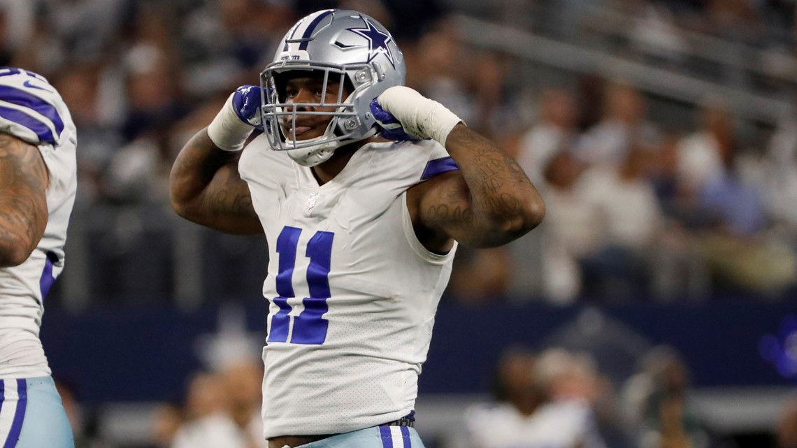 Dallas Cowboys linebacker Micah Parsons (11) pressures Carolina Panthers  quarterback Sam Darnold (14) during an NFL football game, Sunday, Oct. 3,  2021, in Arlington, Texas. Parsons would sack Darnold on the play.