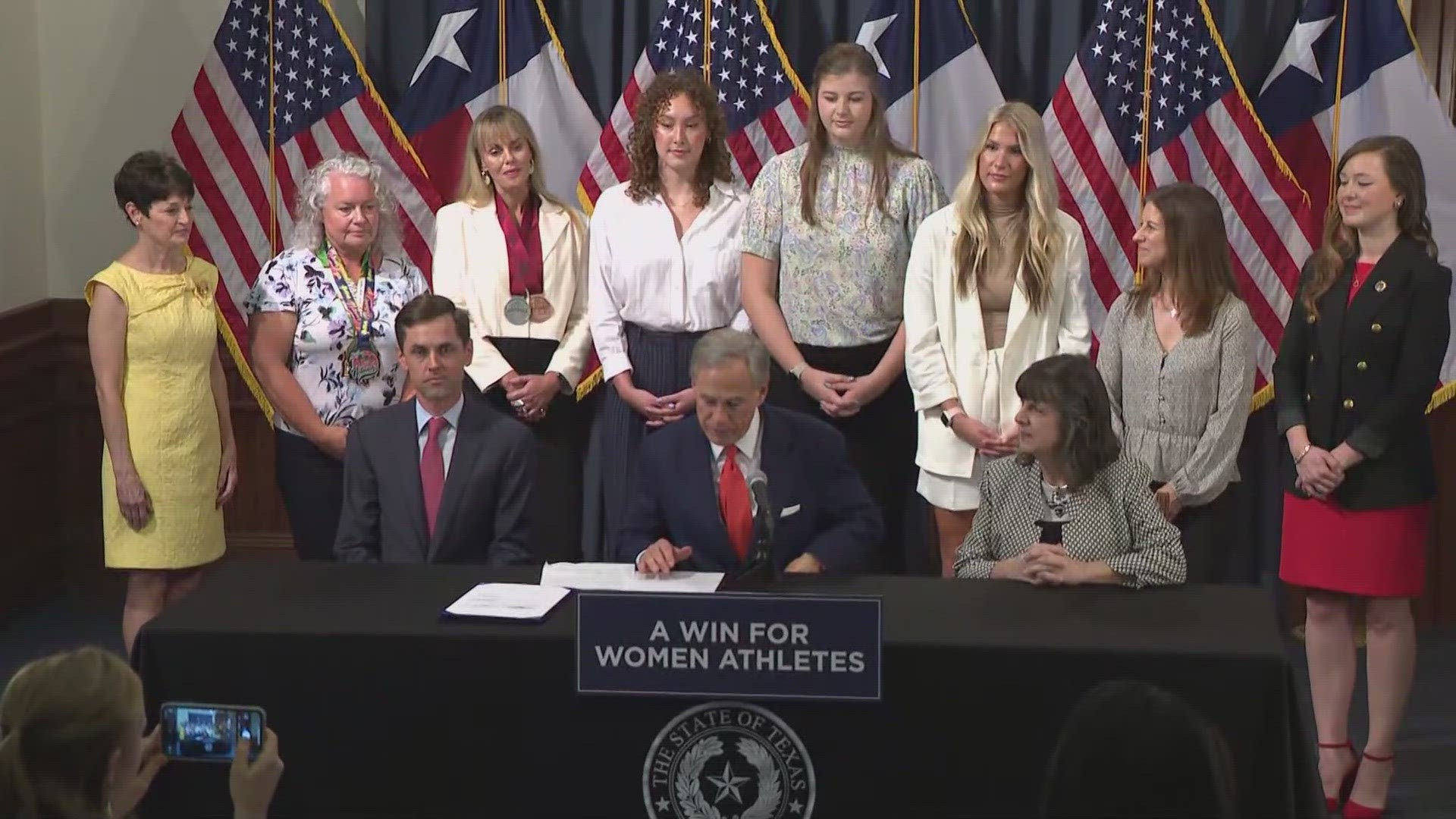 Texas governor signs law that athletes at public universities must compete  based on biological sex