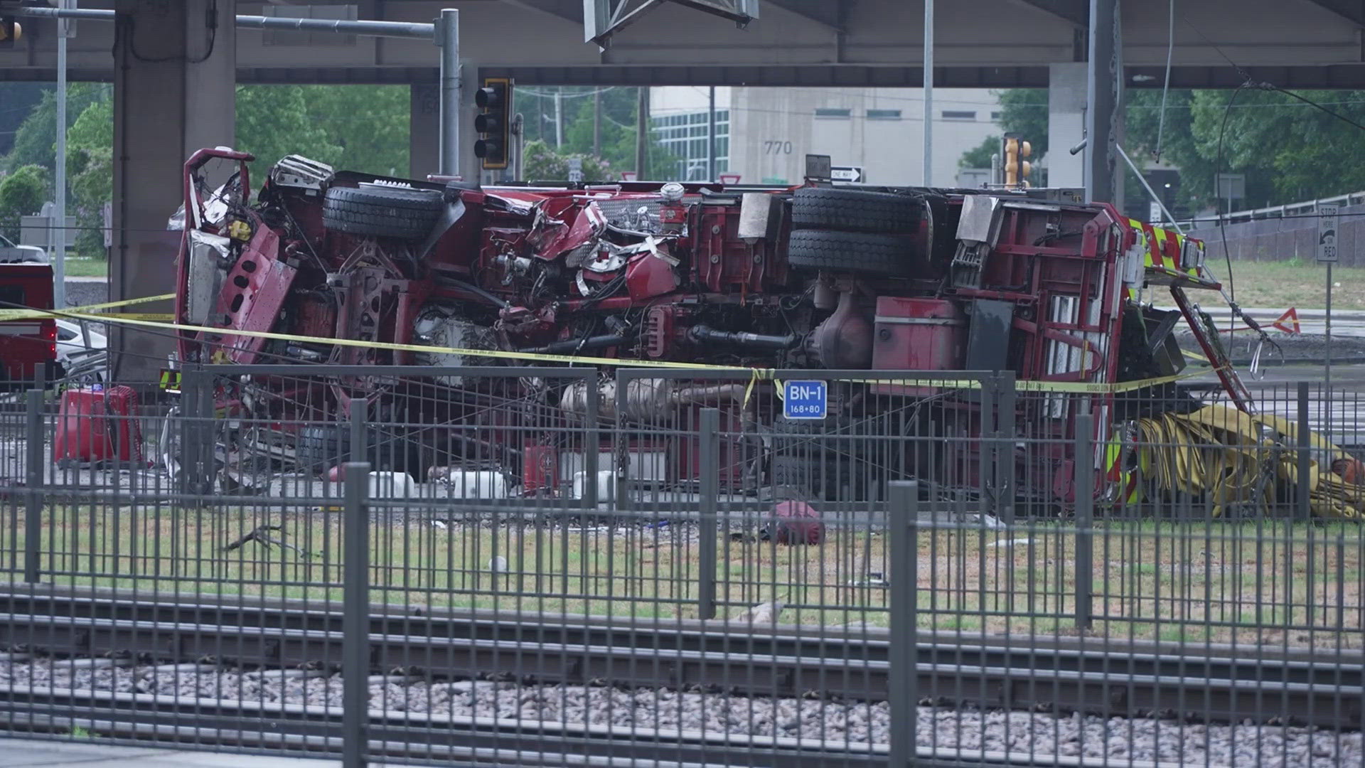 A DFR fire engine crashed off the interstate and fell into a DART rail line, causing major closures for the roads and railways.