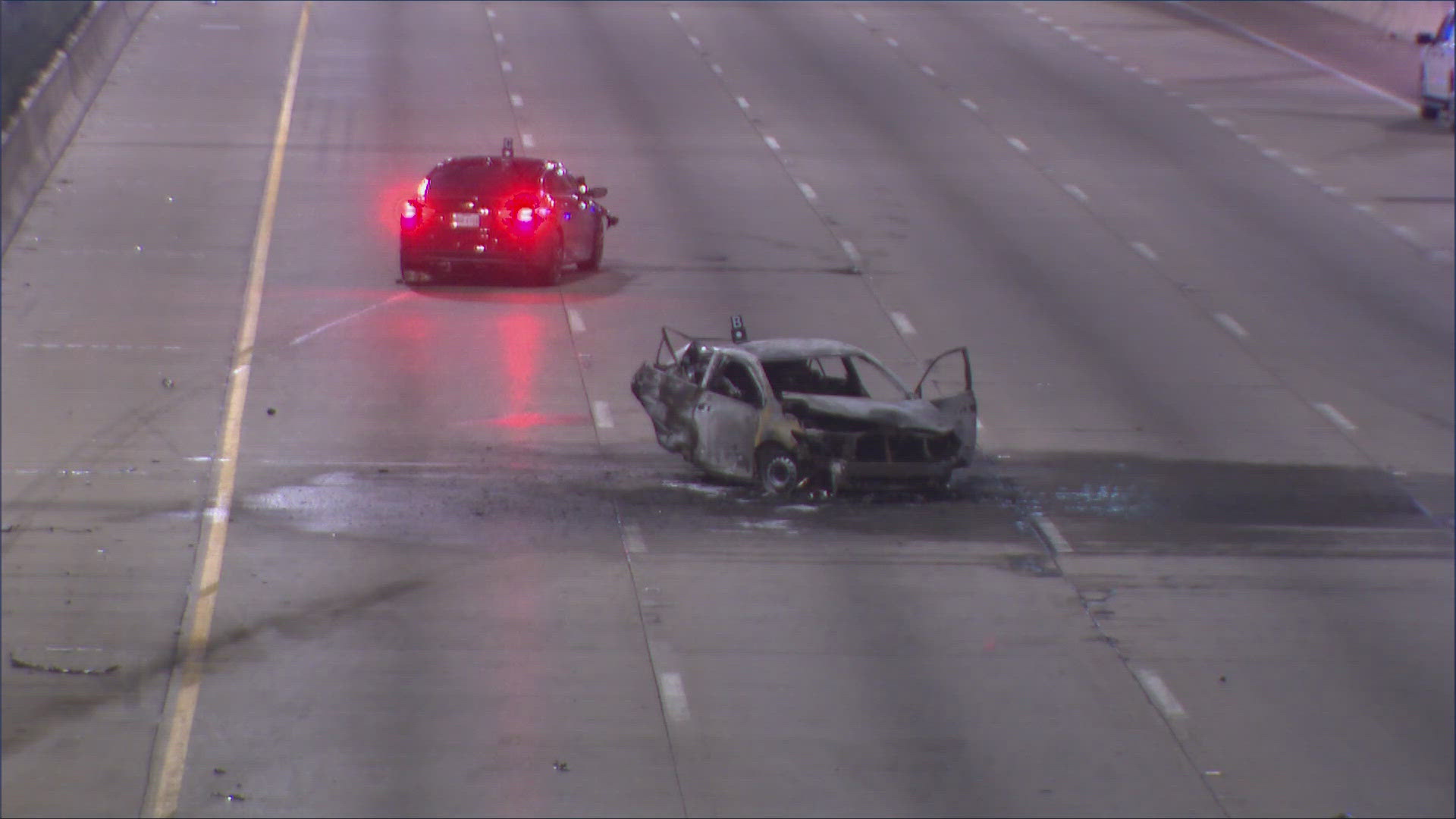 US 75 was closed Wednesday morning near Caruth Haven Lane after a vehicle caught fire, killing two people, officials said.