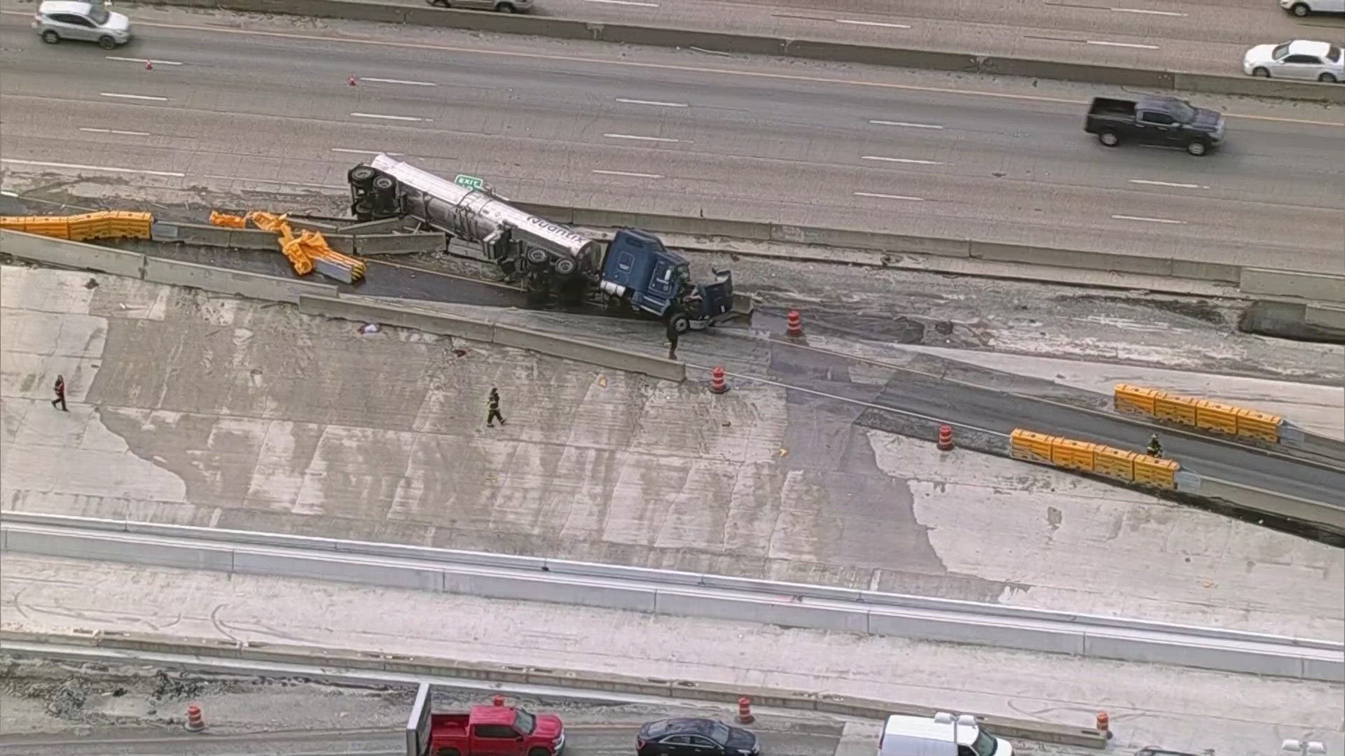 An 18-wheeler crashed into a concrete wall along I-635 in Garland on Thursday morning, blocking lanes of traffic and prompting a hazmat response.