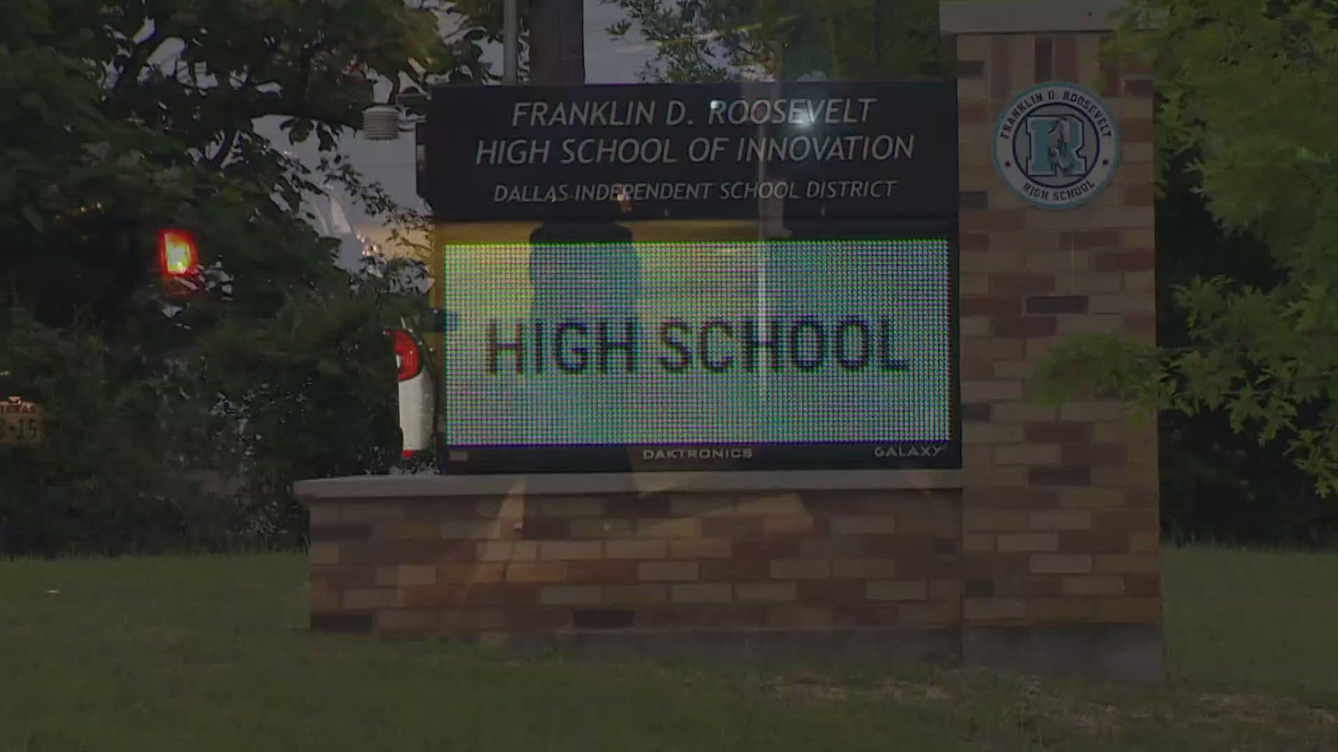 Two high school football players were hospitalized after they were injured in a drive-by shooting in Dallas while riding home from practice with their coach.