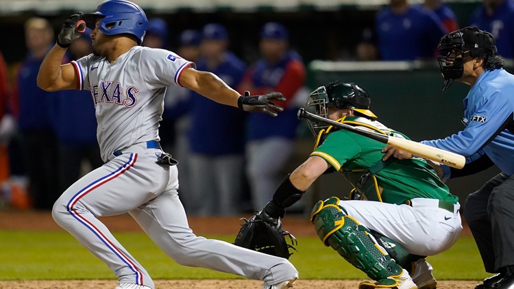 PHOTOS: Rangers rally in 9th again to beat A's 8-5 for 3rd in row
