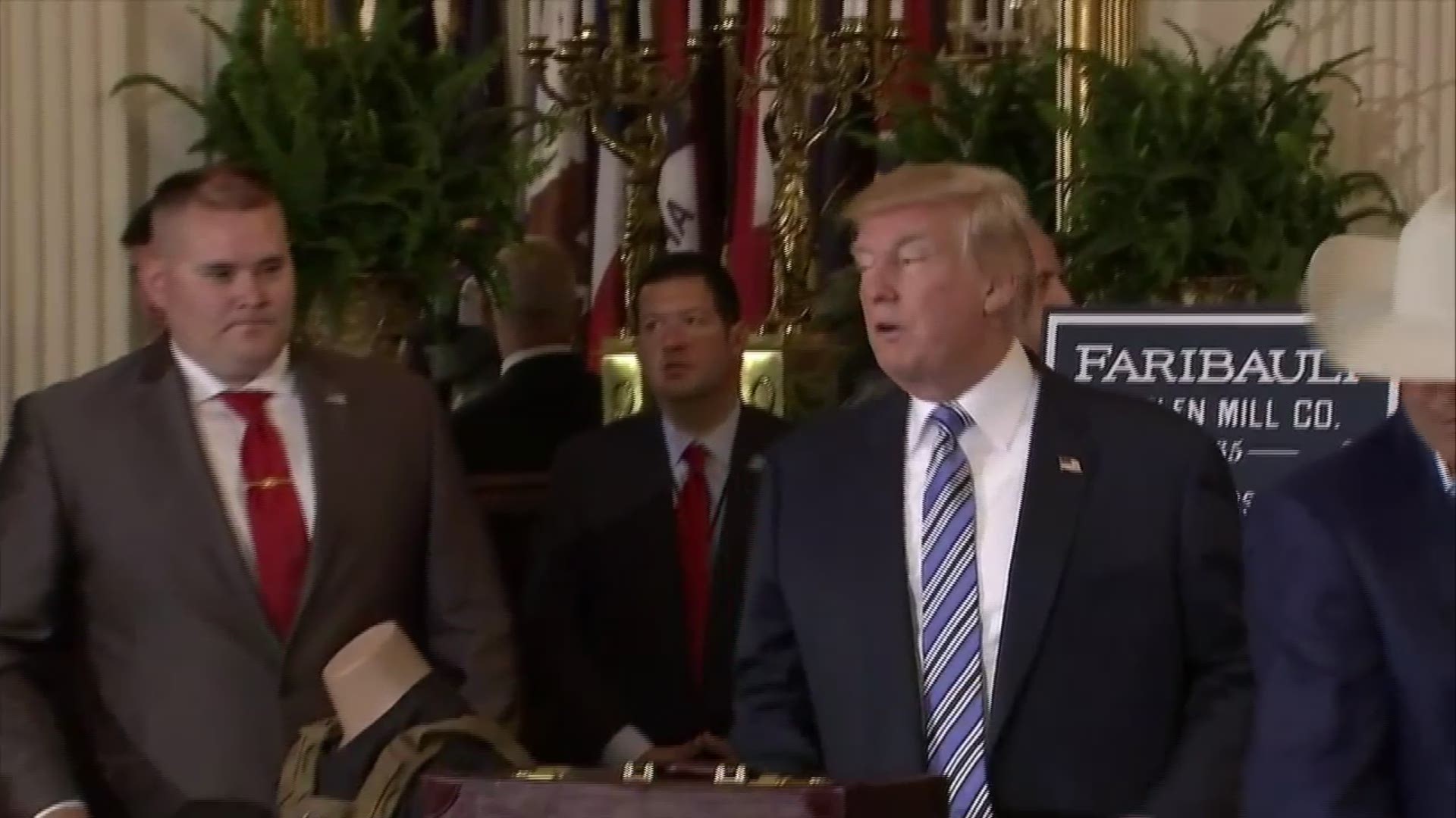 President Donald Trump put on a Stetson cowboy hat during "Made in America Week" festivities at the White House Monday. ABC