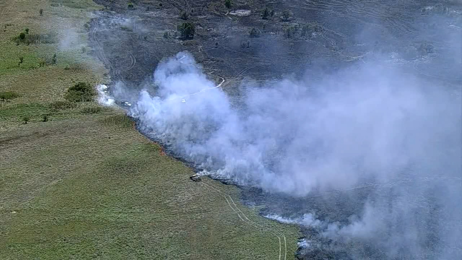 WFAA's Chopper 8 captured crews working to put out a large brush fire between Acton and Cleburne, Texas.