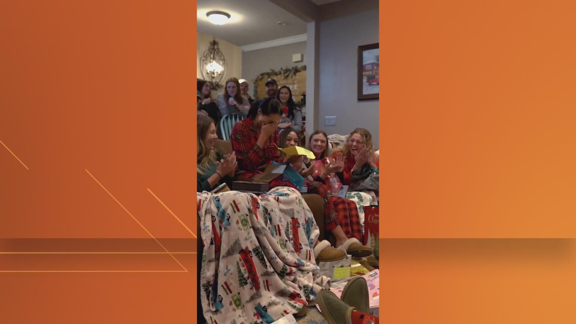 The sophomore San Antonio native was surprised by her team during the gift exchange.