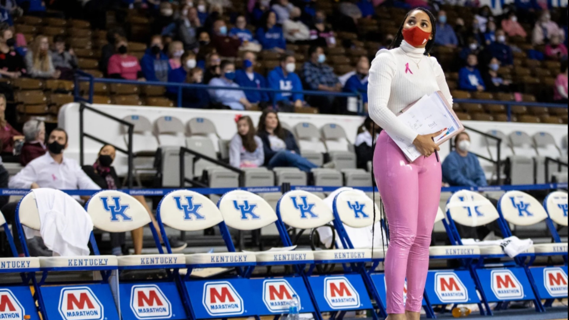 Coach Carter's courtside attire sparked controversy online with some stating her pink pants worn during a game were unprofessional.
