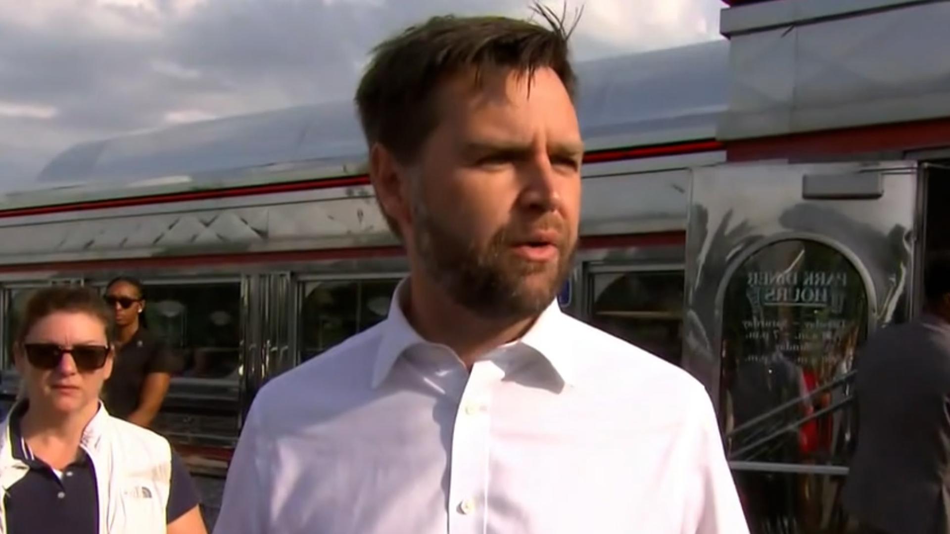 Republican Vice Presidential nominee JD Vance speaks to the media outside of Park Diner in St. Cloud, Minnesota.