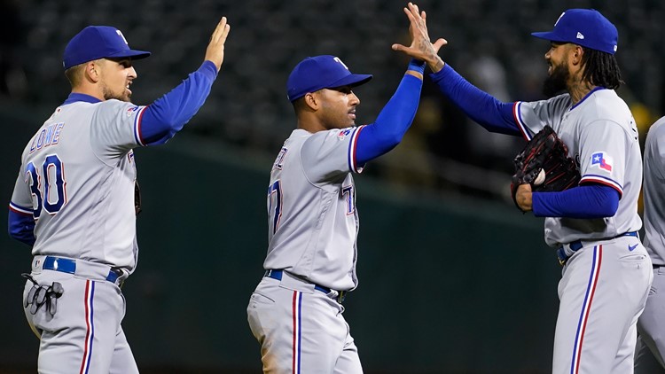 Rangers rally in 9th again to beat A's 8-5 for 3rd in row