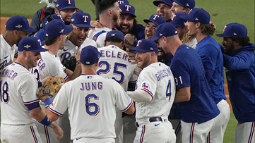 Creed band members at ALCS Game 3 in Texas Rangers gear