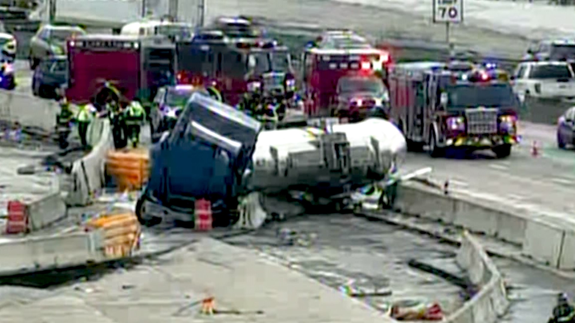 An 18-wheeler crashed into a concrete wall along I-635 in Garland on Thursday morning, blocking lanes of traffic and prompting a hazmat response.