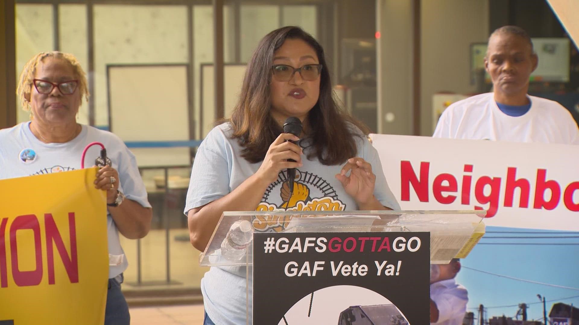 “Nothing will ever fully depict what’s it’s like to live next door to GAF,” Janie Cisneros told the crowd outside city hall.