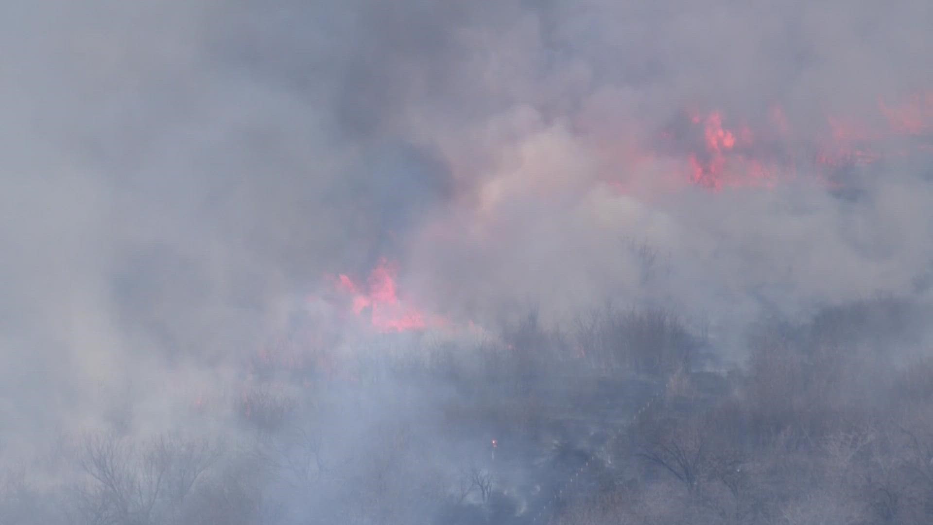 Crews responded to large brush fire near Lewisville Lake dam in Denton County.