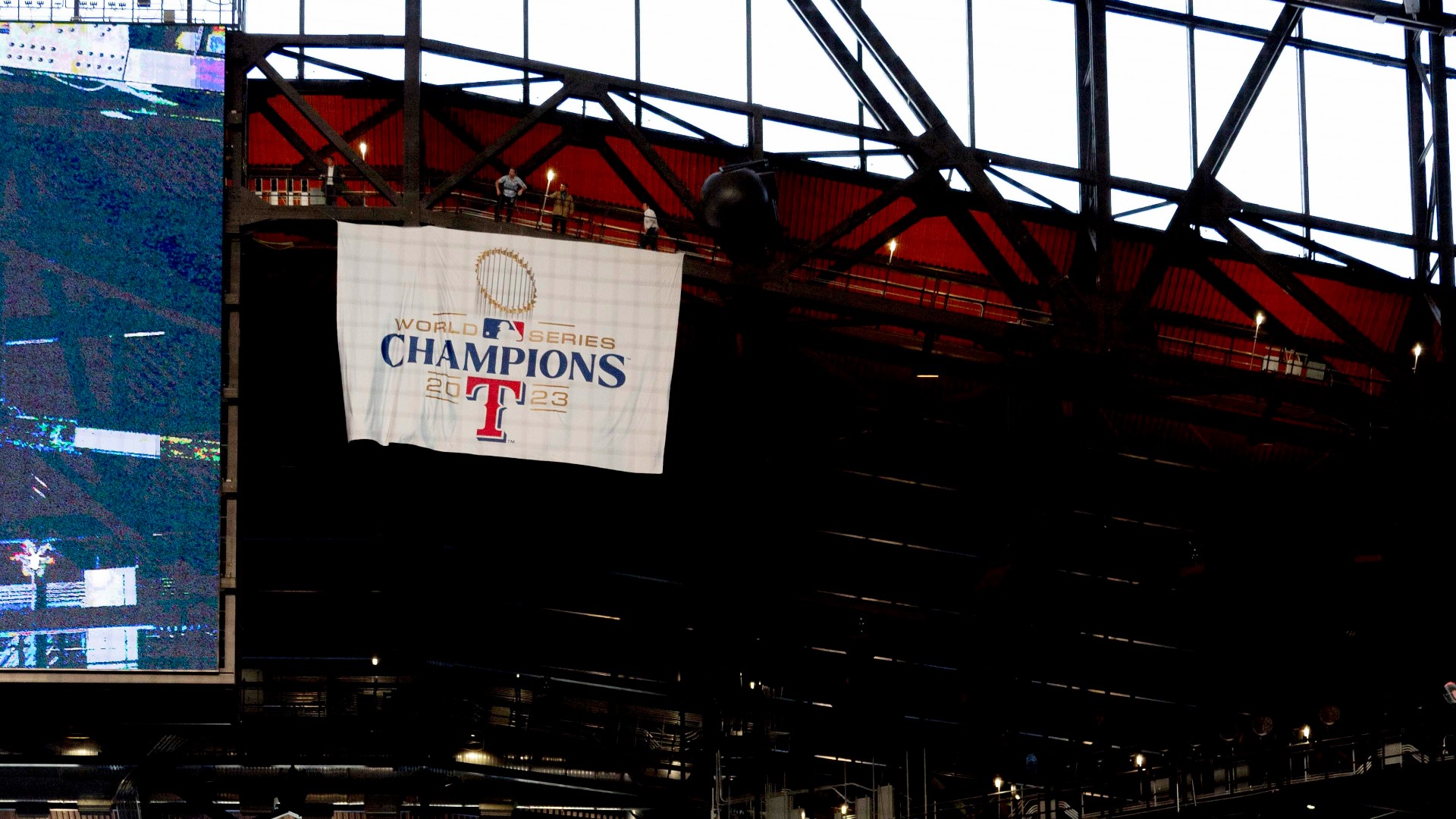 The team unveiled its first championship banner in a pregame ceremony Thursday night ahead of the Rangers' Opening Day matchup against the Chicago Cubs.