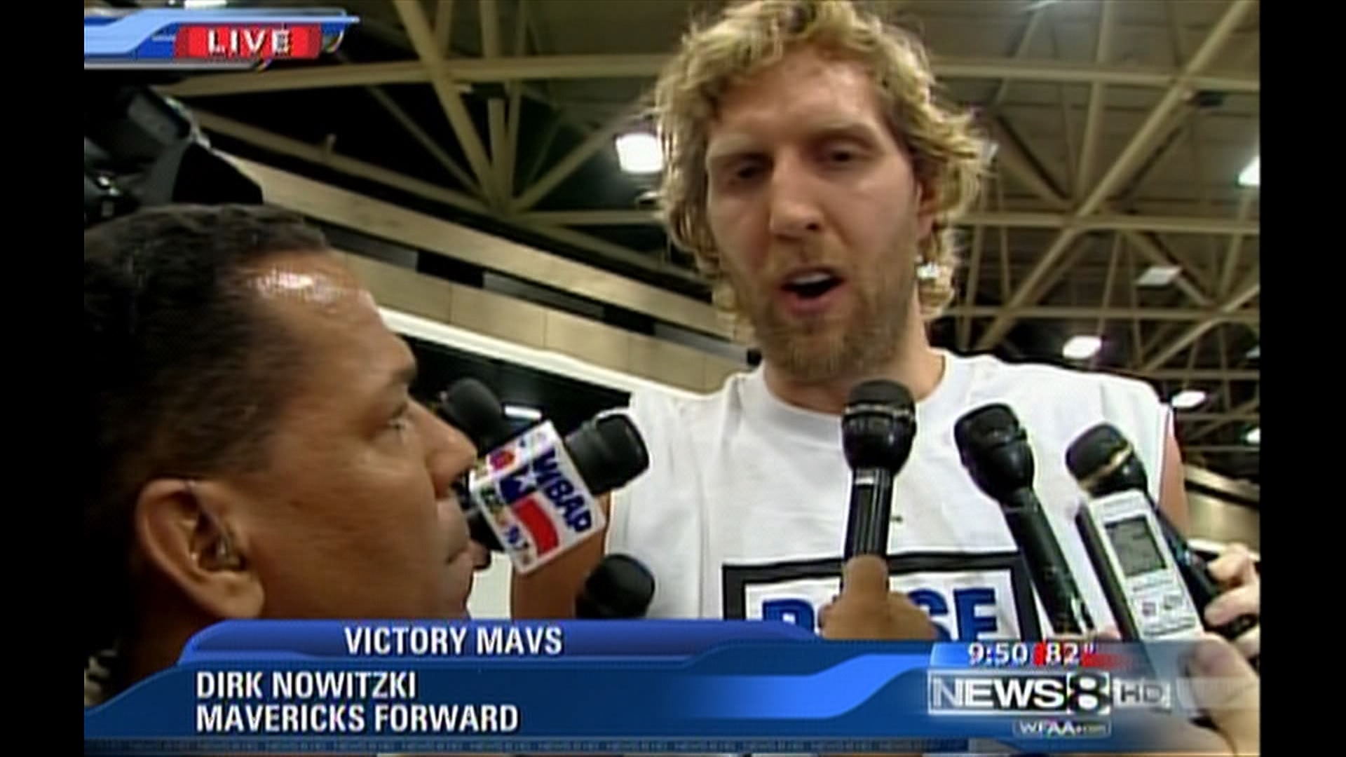 WFAA interviews Dirk Nowitzki during the Dallas Mavericks' 2011 NBA Championship Parade on June 16, 2011, in Dallas, Texas.