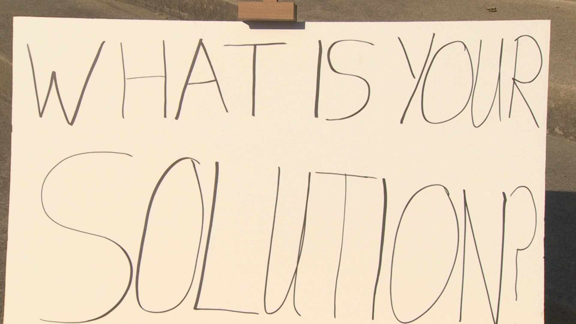 After setting up two chairs and a camera, WFAA wrote a question on a nearby whiteboard and waited for anyone who wanted to speak their mind: "What is your solution?"