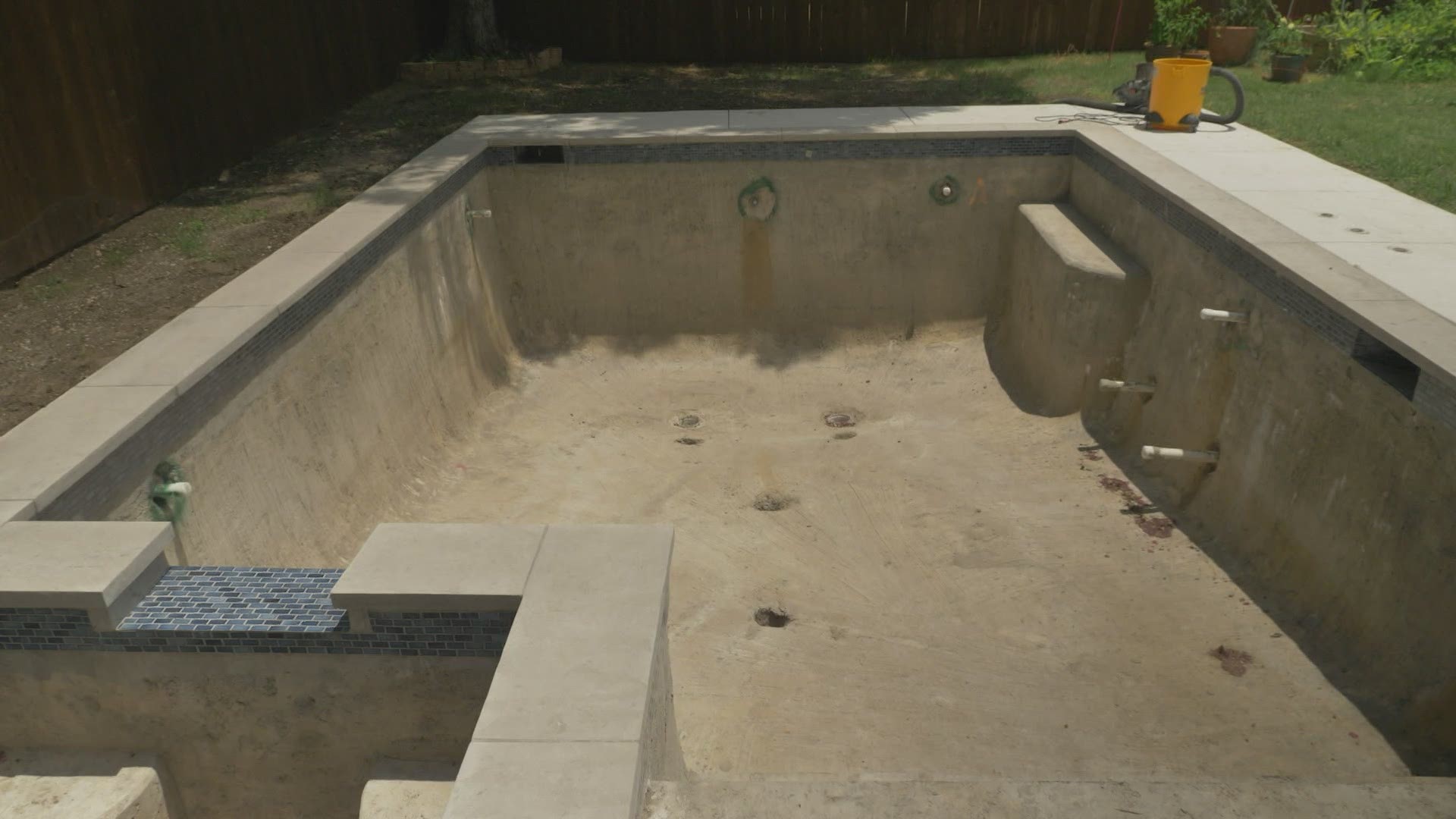 Nearly 10 months later, all MacKenzie McCarver has is this unfinished hole with no idea when the pool will be finished.