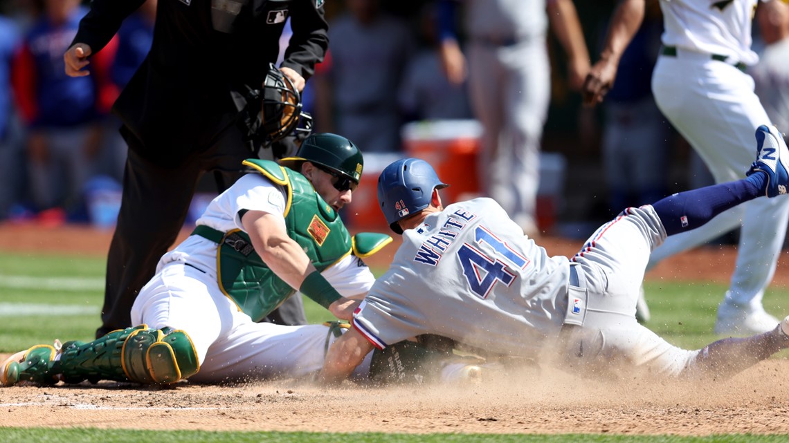 Rangers rally twice over Mariners, snap 14-game road skid