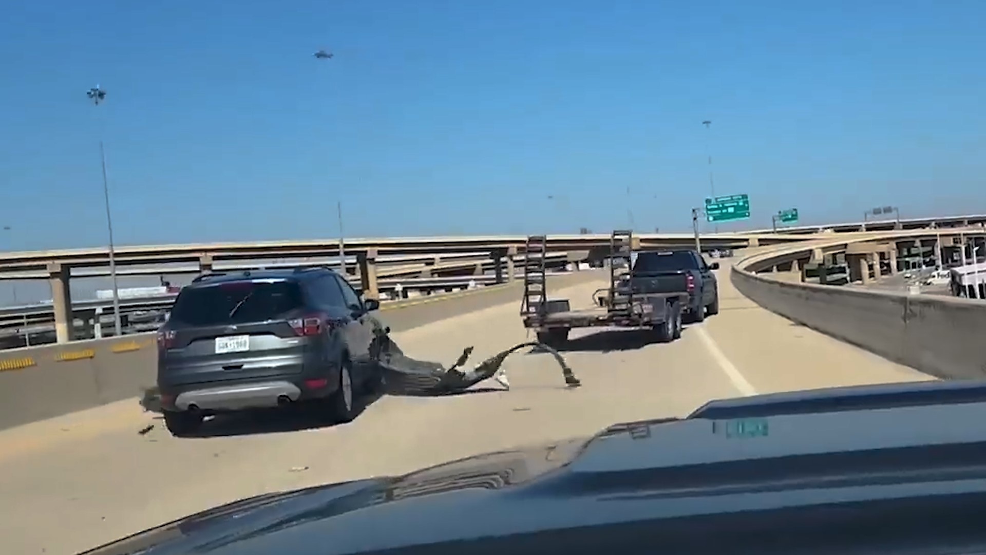 Some viral dashcam video was first posted showing a truck's flatbed trailer rip an SUV's bumper off. The SUV driver then later shared what led up to that incident.