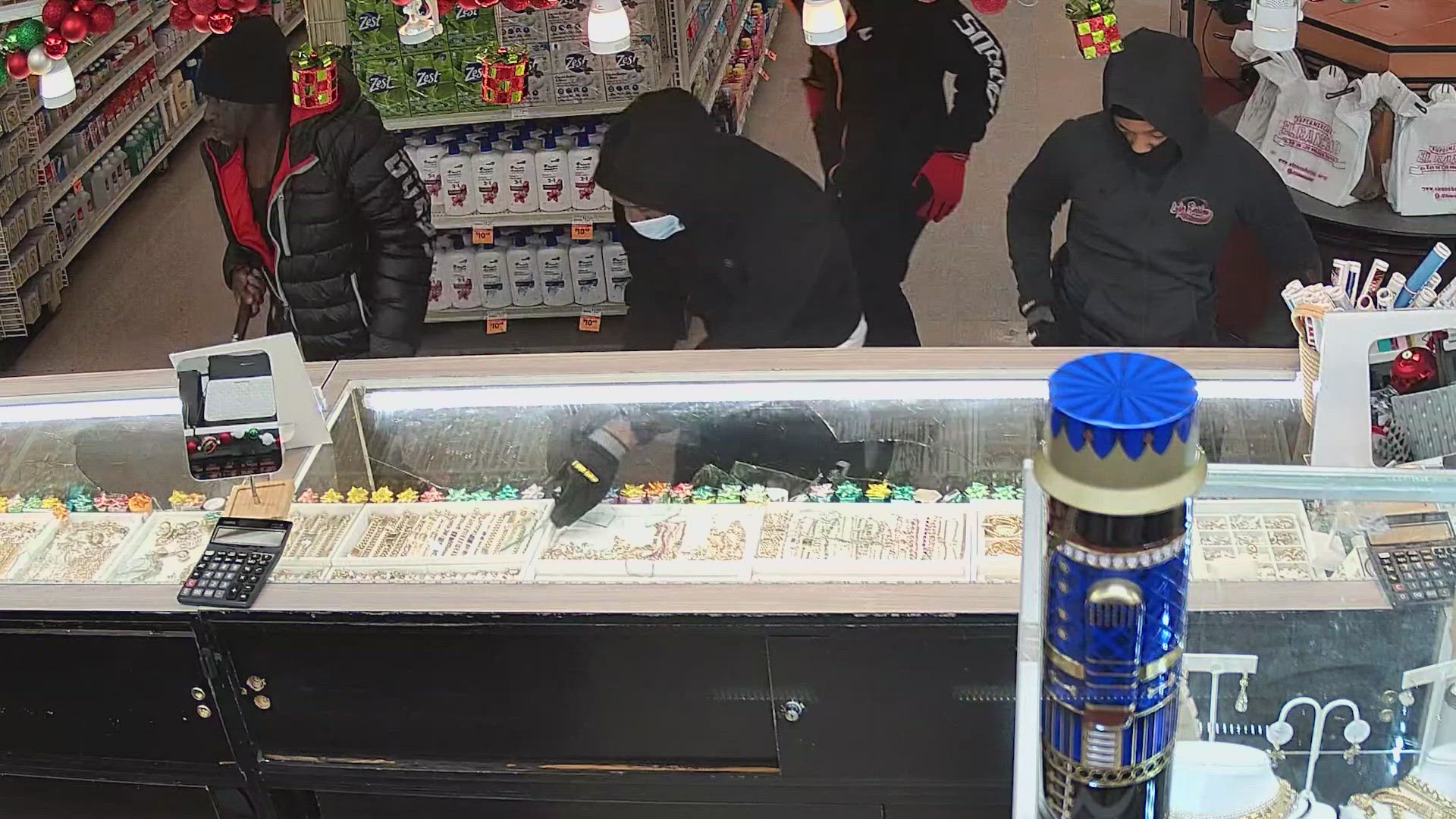 Surveillance footage shared by the owner of the store showed at least four suspects stealing from jewelry cases at the El Rancho Supermarket around 4:40 p.m.