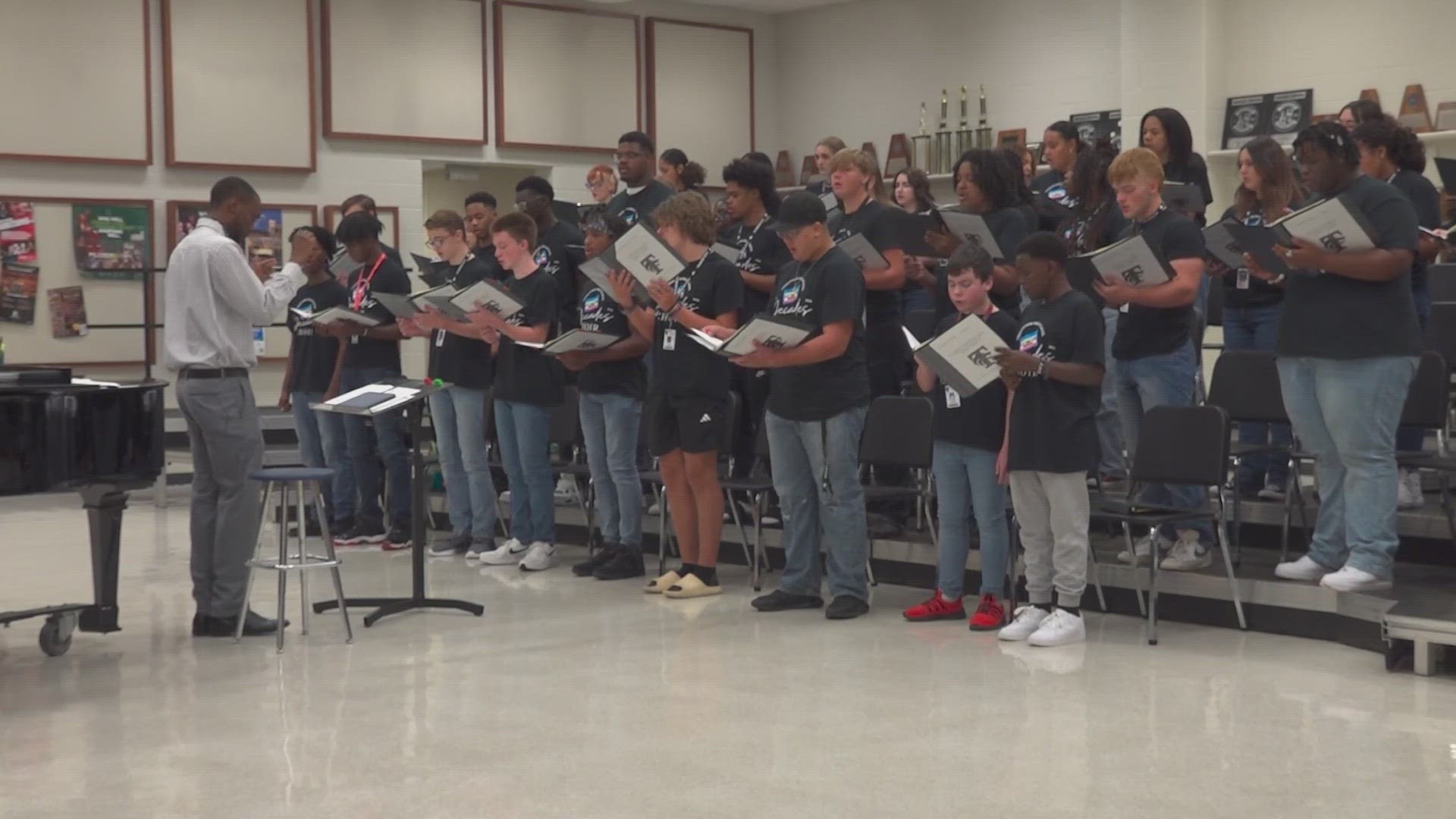 The Mansfield Timberview High School choir director says it has never performed outside the state of Texas