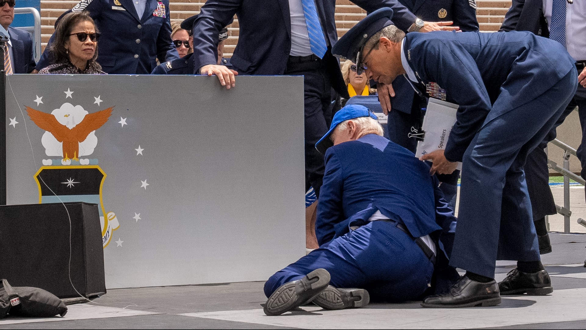 Near the end of the Air Force graduation ceremony, the 80-year-old president turned to walk across the stage and tripped. He was quickly helped up.