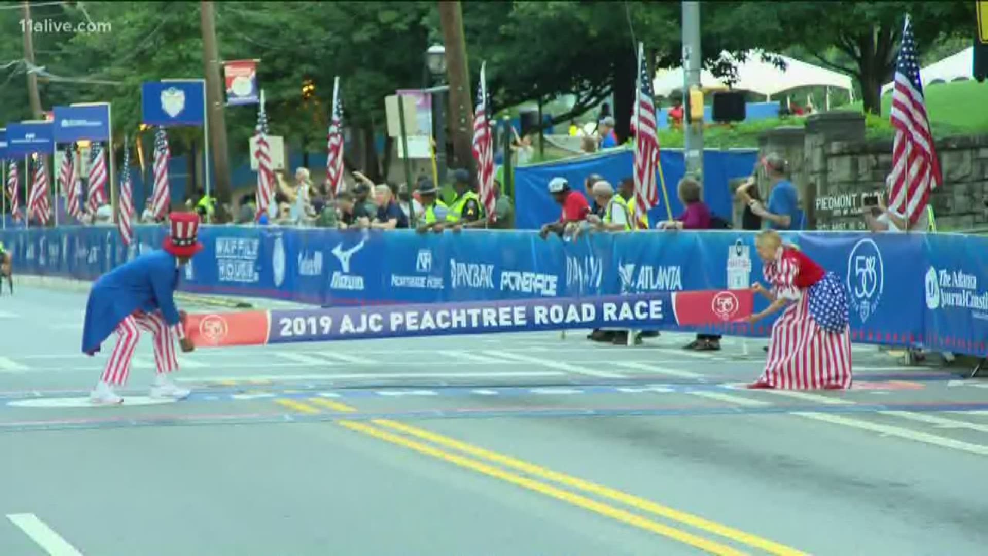 Daniel Romanchuk set an unofficial event record and is set to receive $50,000 for winning the men's wheelchair division of the 50th AJC Peachtree Road Race.