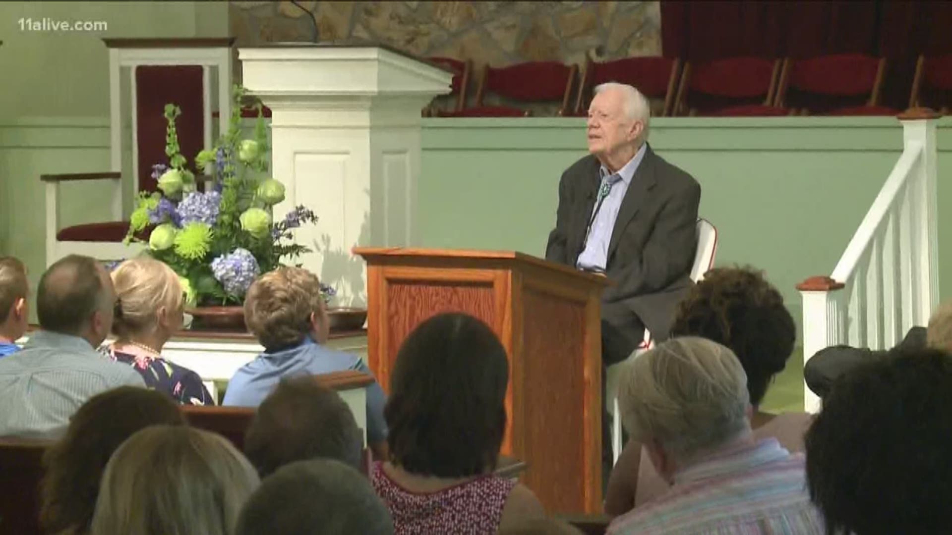 Former president Jimmy Carter and civil rights leader Andrew Young spoke Sunday at Carter's home church in Plains, Georgia.